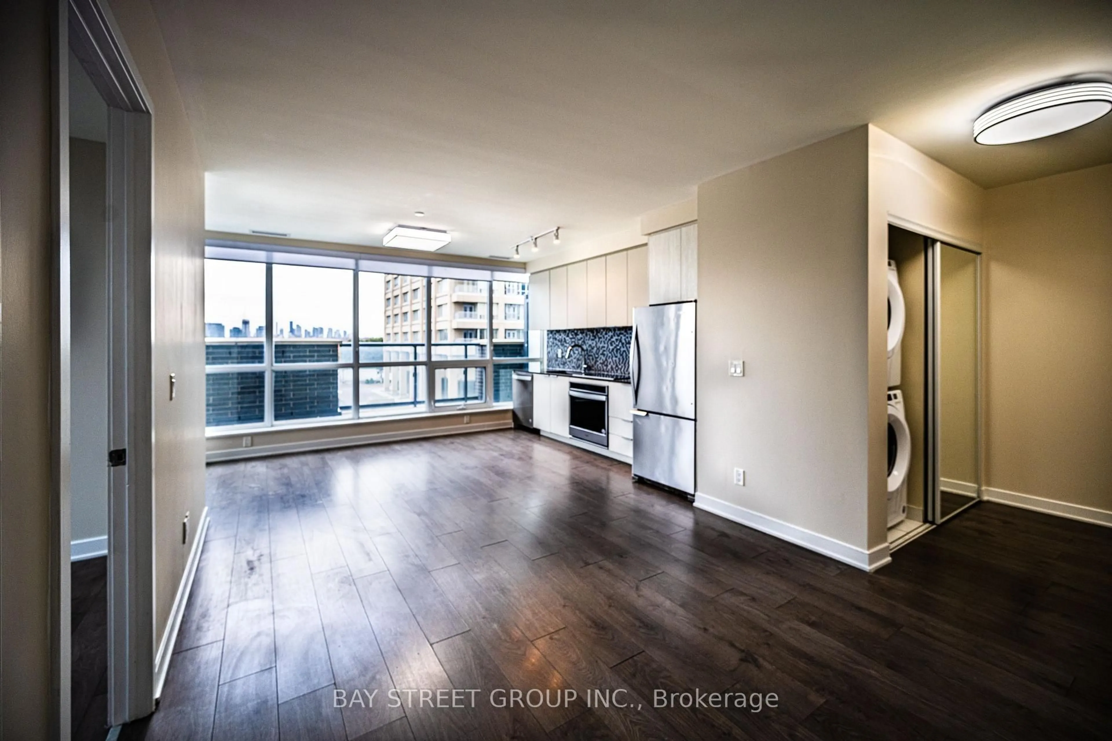 Open concept kitchen, wood/laminate floor for 2 Sonic Way #410, Toronto Ontario M3C 0P2