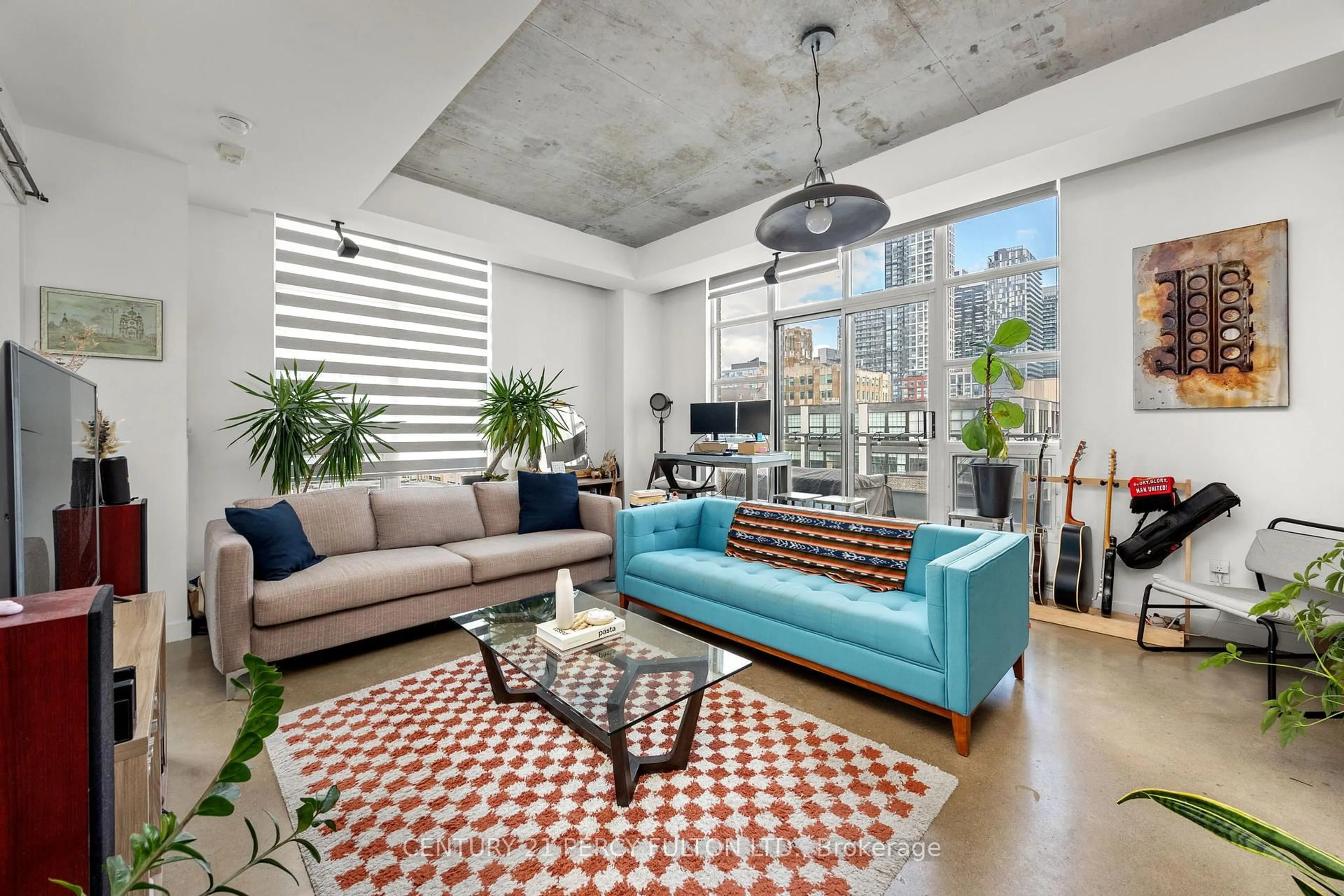 Living room with furniture, cement floor for 23 Brant St #1011, Toronto Ontario M5V 2L5