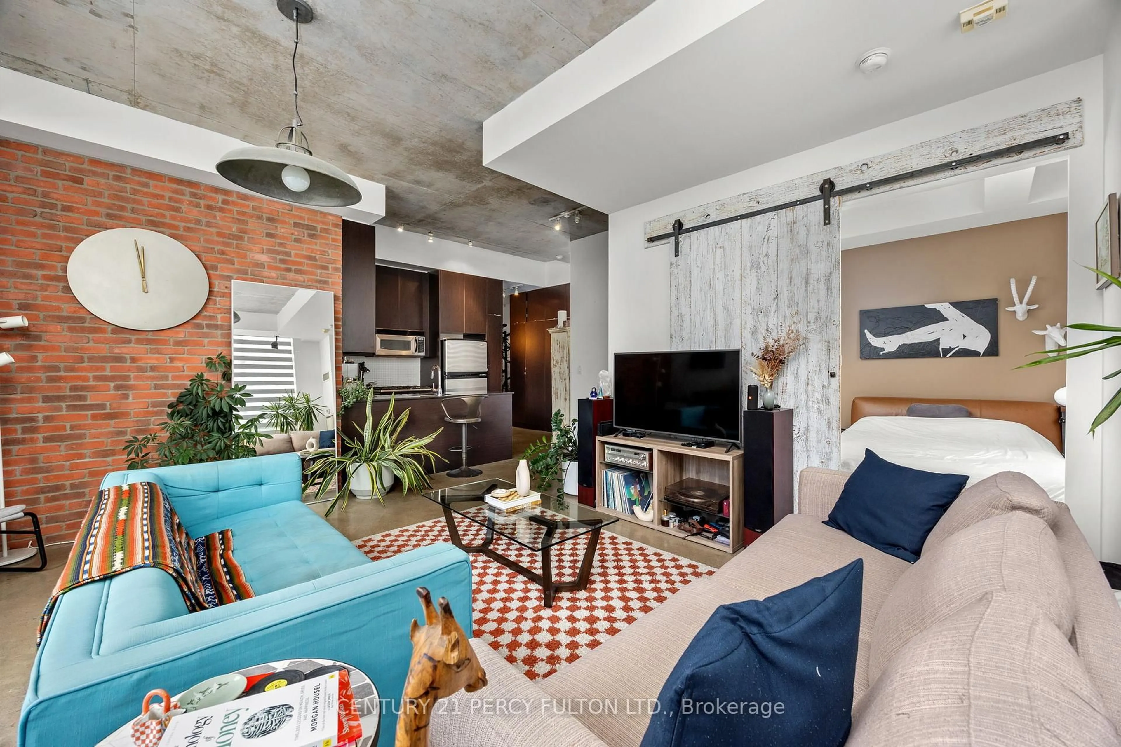 Living room with furniture, cement floor for 23 Brant St #1011, Toronto Ontario M5V 2L5