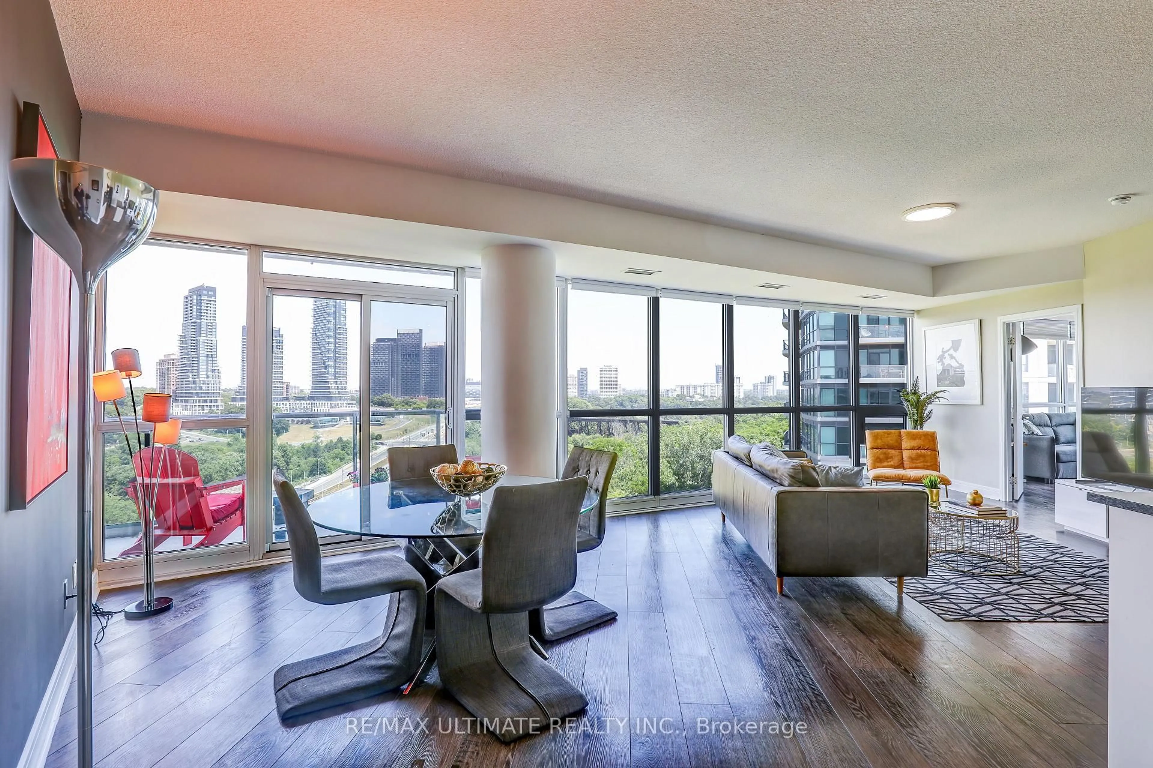 Living room with furniture, wood/laminate floor for 35 Brian Peck Cres #807, Toronto Ontario M4G 0A5