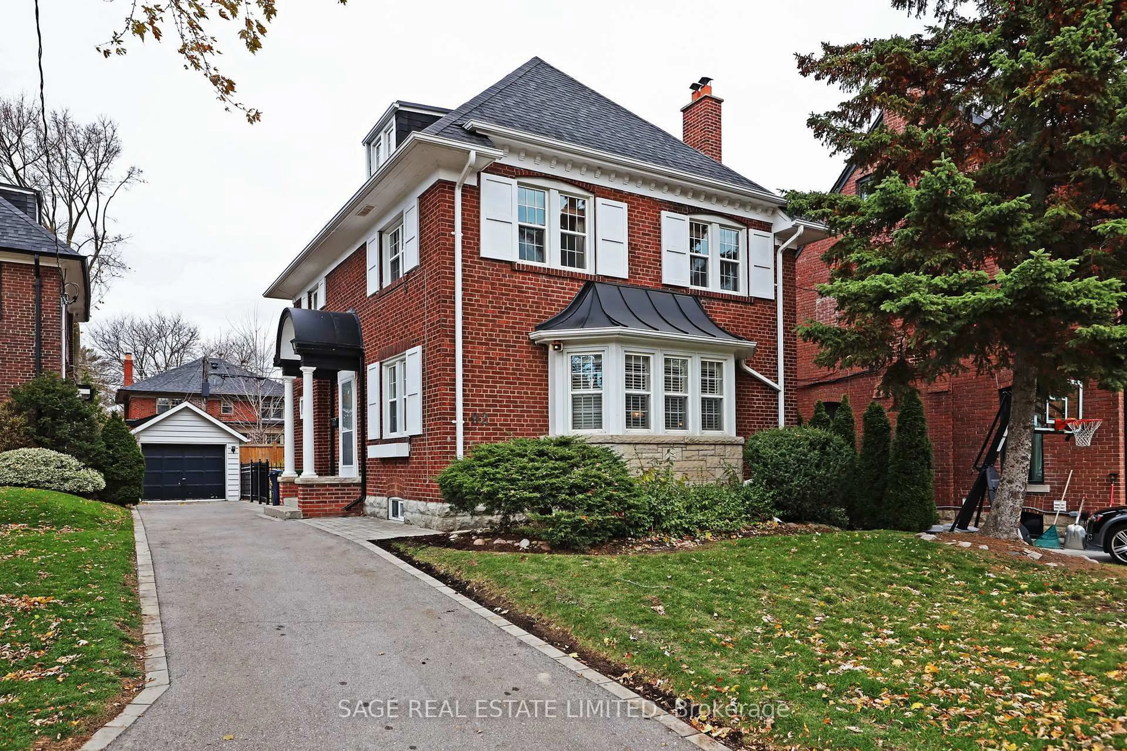 Home with brick exterior material, street for 92 Chatsworth Dr, Toronto Ontario M4R 1R7