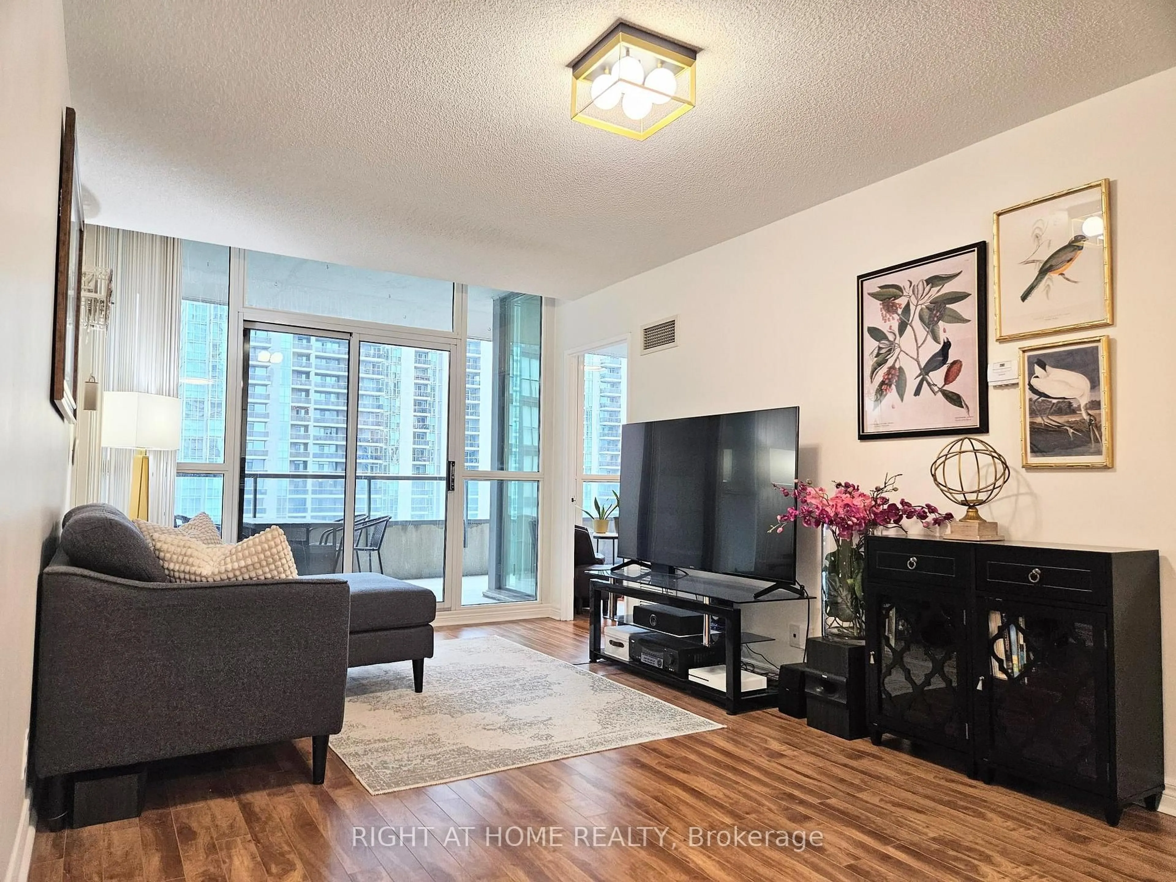 Living room with furniture, wood/laminate floor for 23 Hollywood Ave #1511, Toronto Ontario M2N 7L8