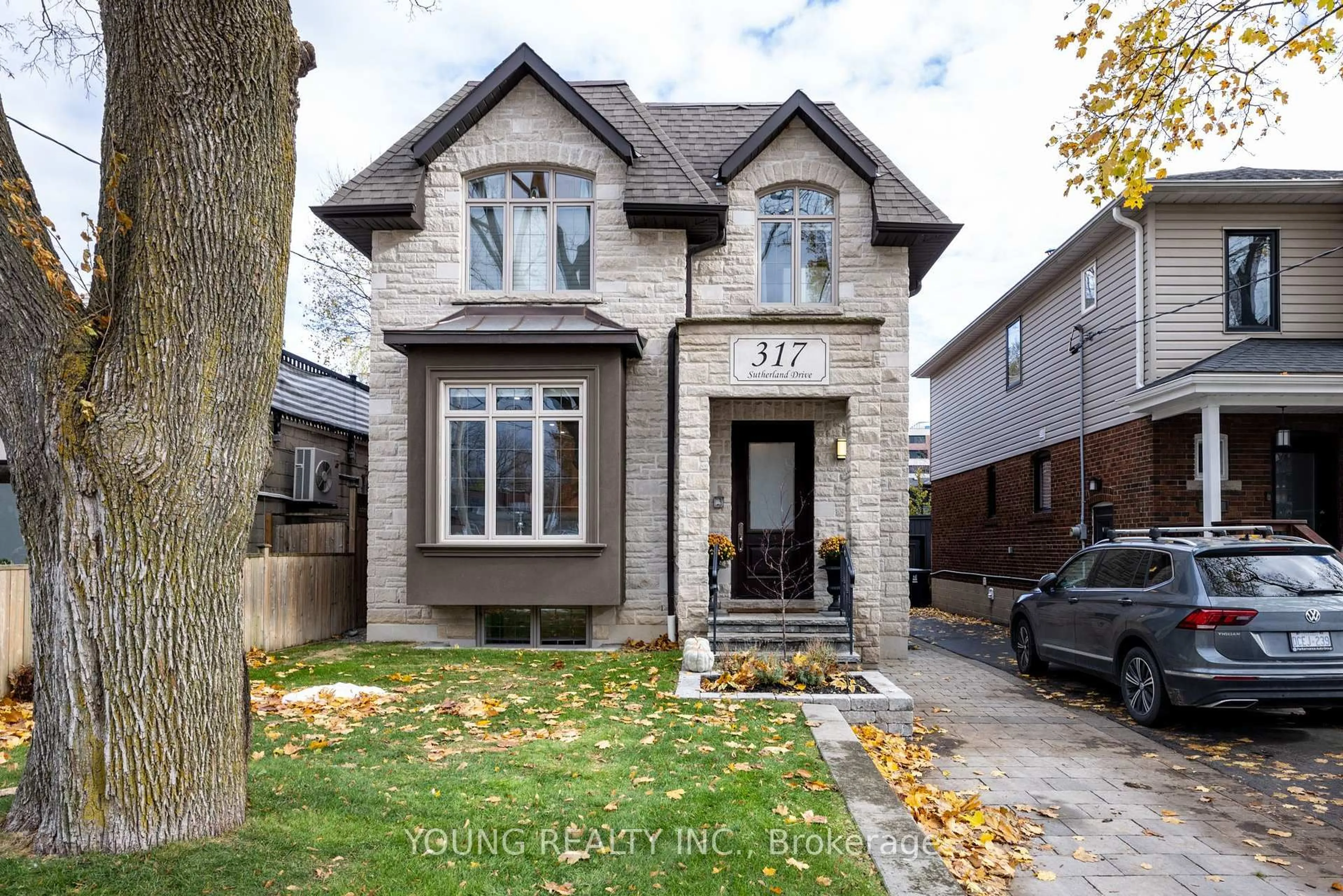Home with brick exterior material, street for 317 Sutherland Dr, Toronto Ontario M4G 1J6