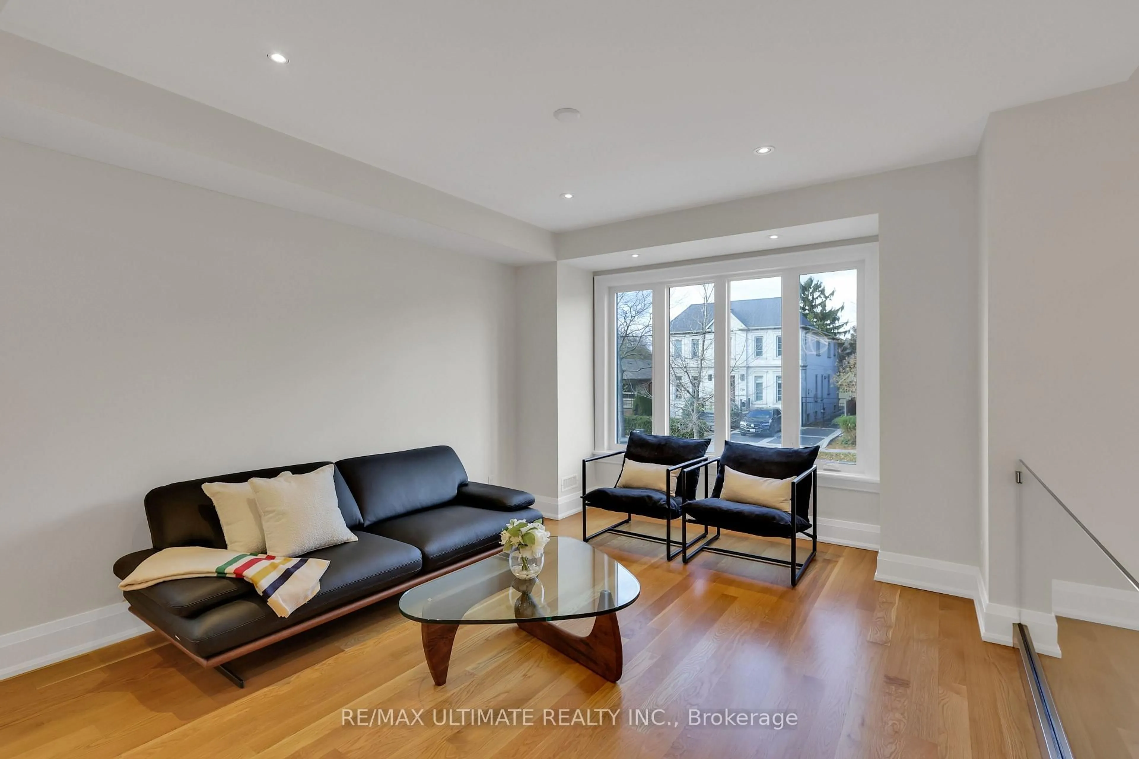 Living room with furniture, wood/laminate floor for 743 Glencairn Ave, Toronto Ontario M6B 1Z9