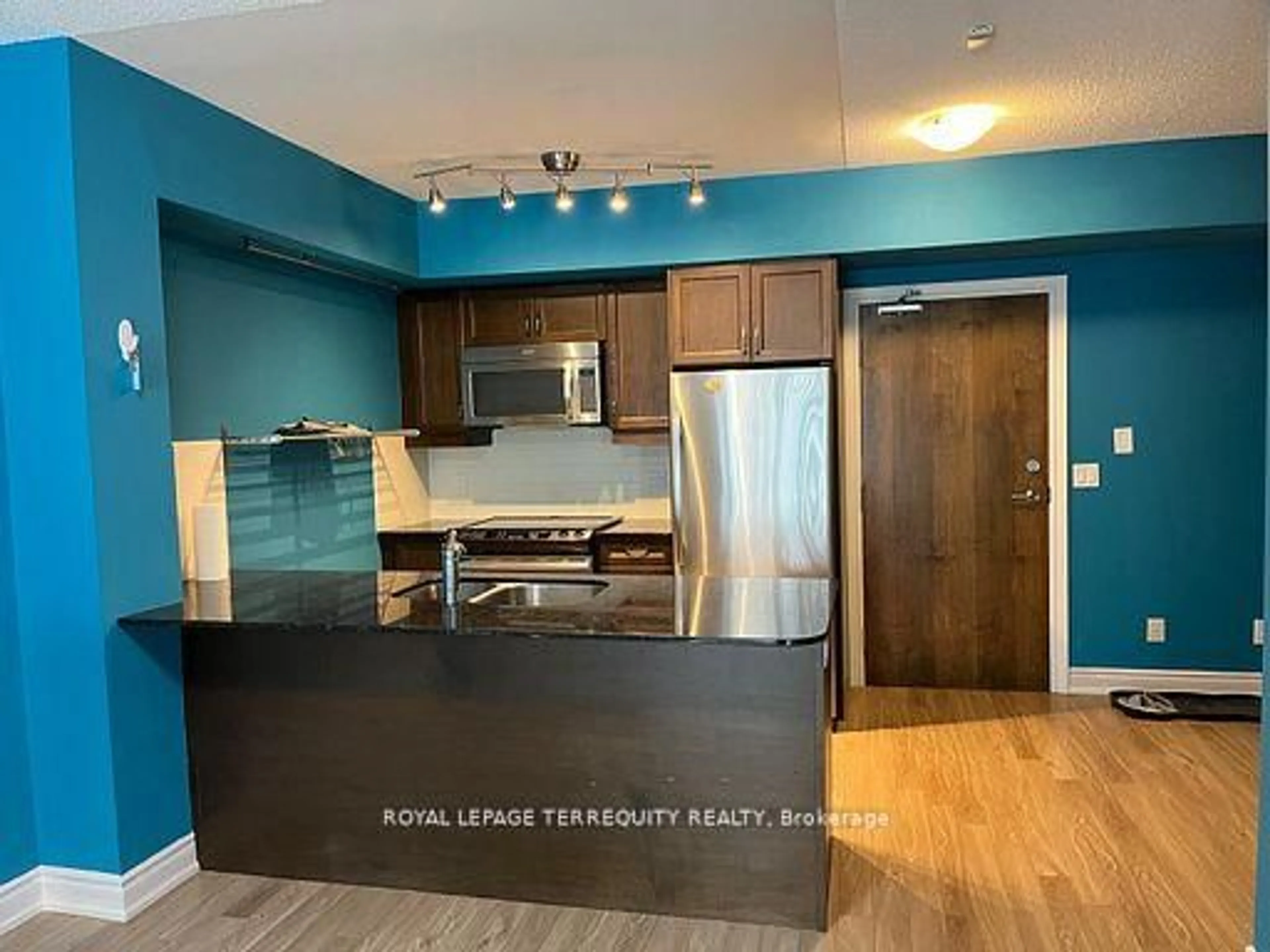 Open concept kitchen, wood/laminate floor for 701 Sheppard Ave #234, Toronto Ontario M3H 0B2