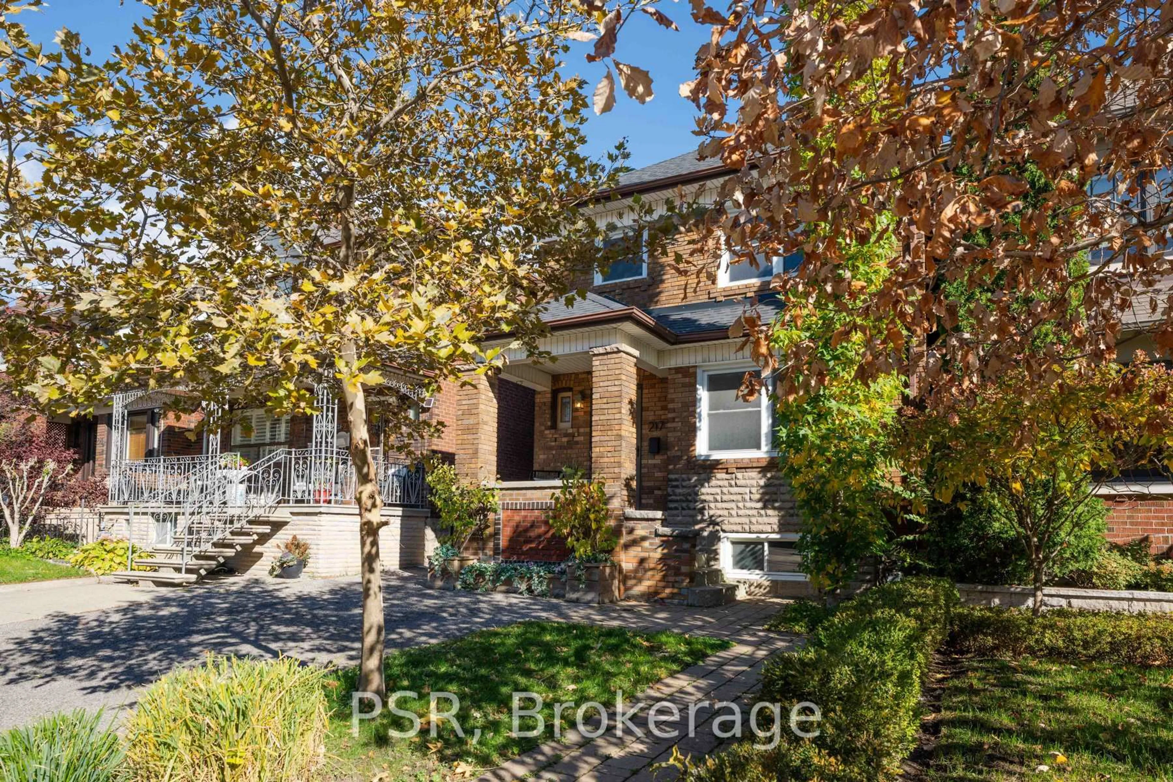 Home with brick exterior material, street for 217 Northcliffe Blvd, Toronto Ontario M6E 3K8