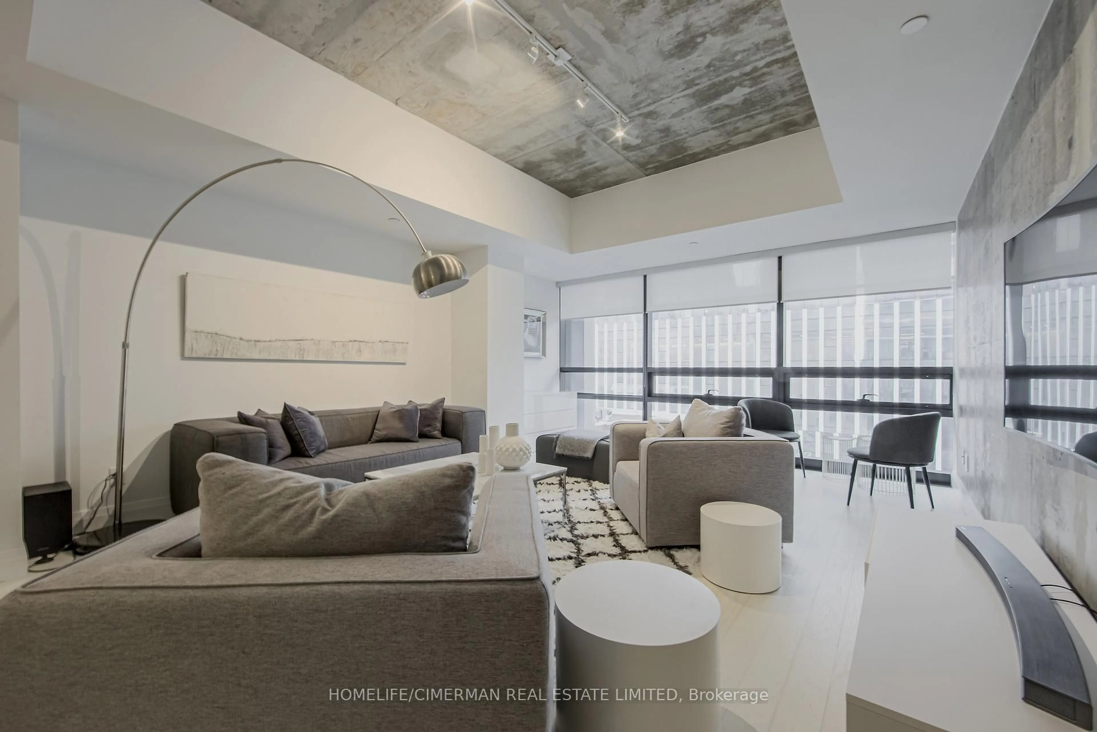 Living room with furniture, cement floor for 224 King St #501, Toronto Ontario M5V 1H8