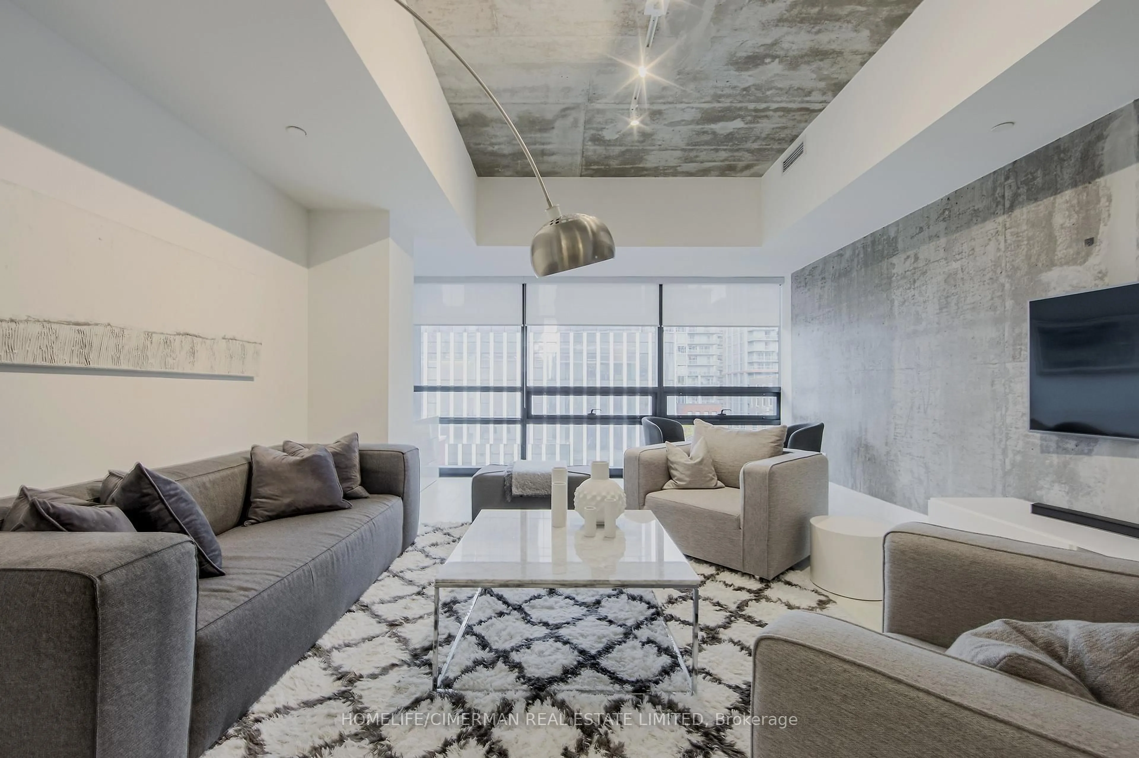 Living room with furniture, cement floor for 224 King St #501, Toronto Ontario M5V 1H8
