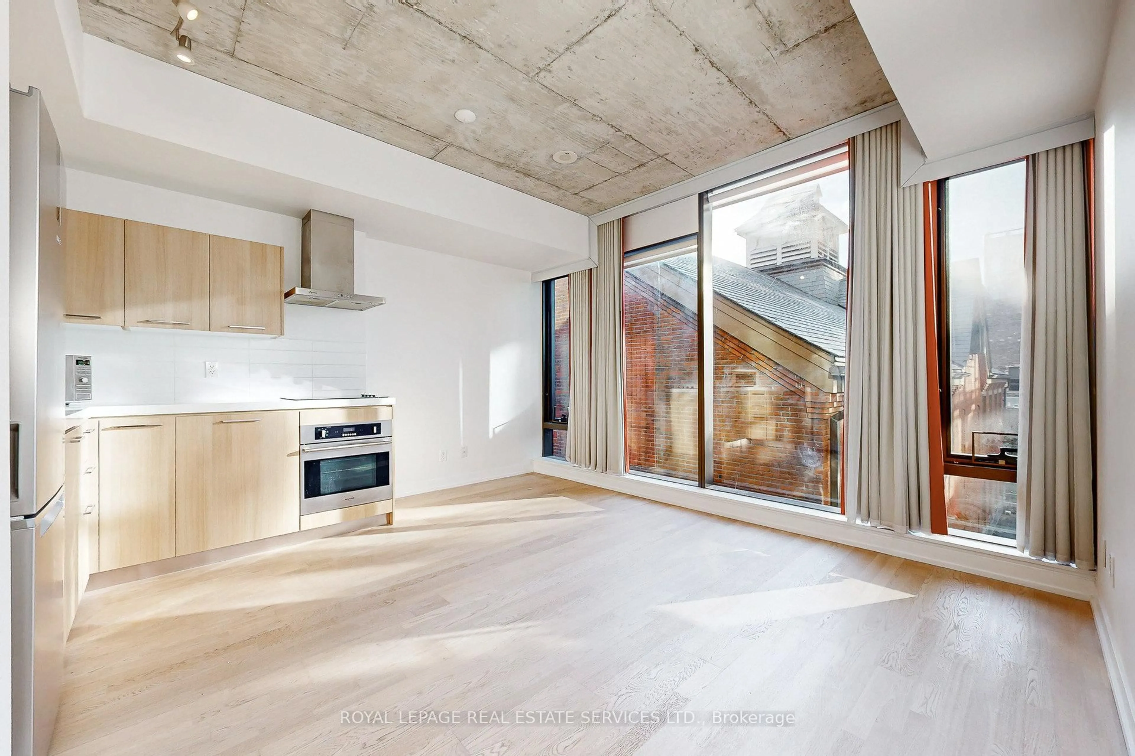 Open concept kitchen, cement floor for 560 King St #417, Toronto Ontario M5V 1M3