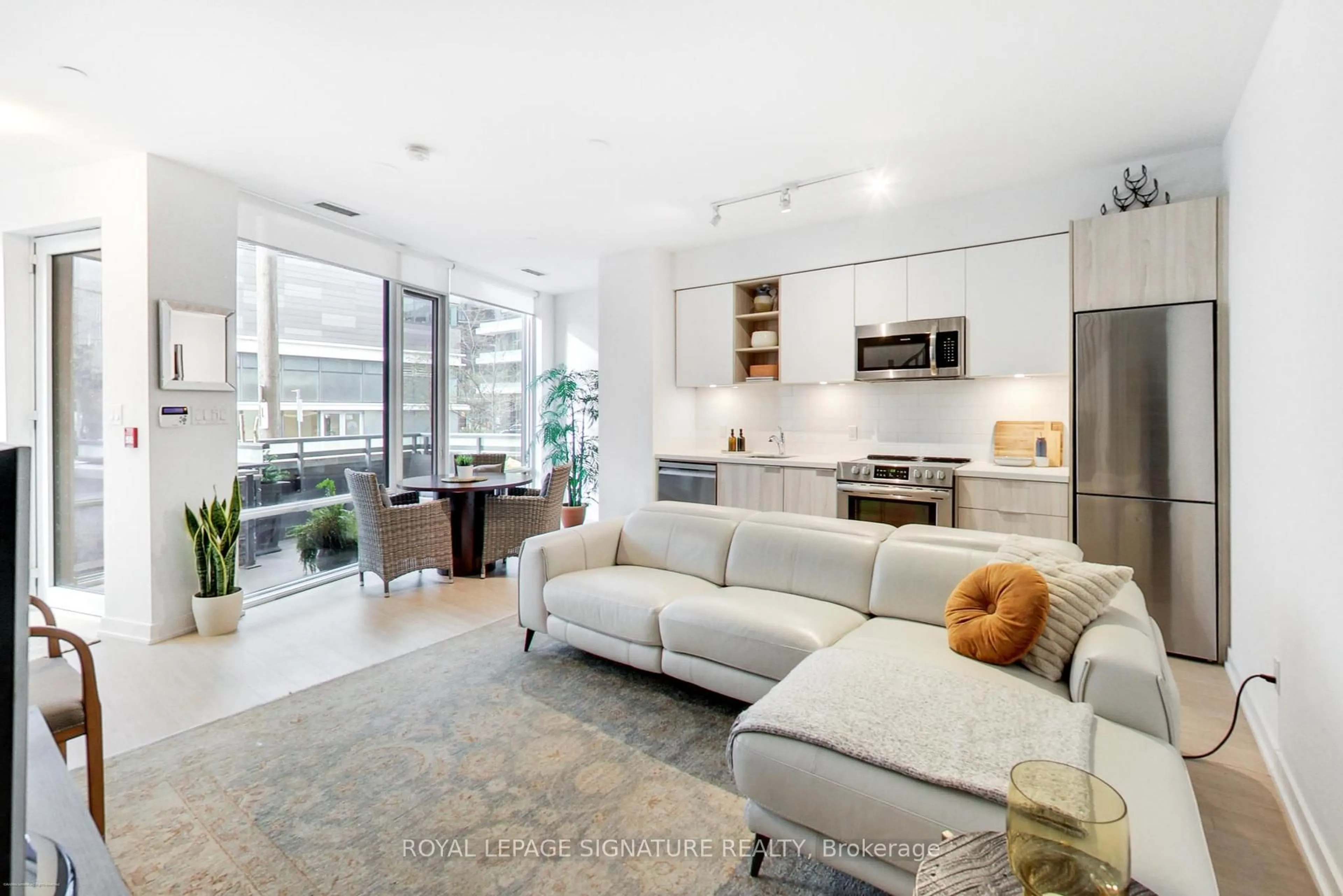 Living room with furniture, unknown for 30 Ordnance St #TH105, Toronto Ontario M6K 0C8