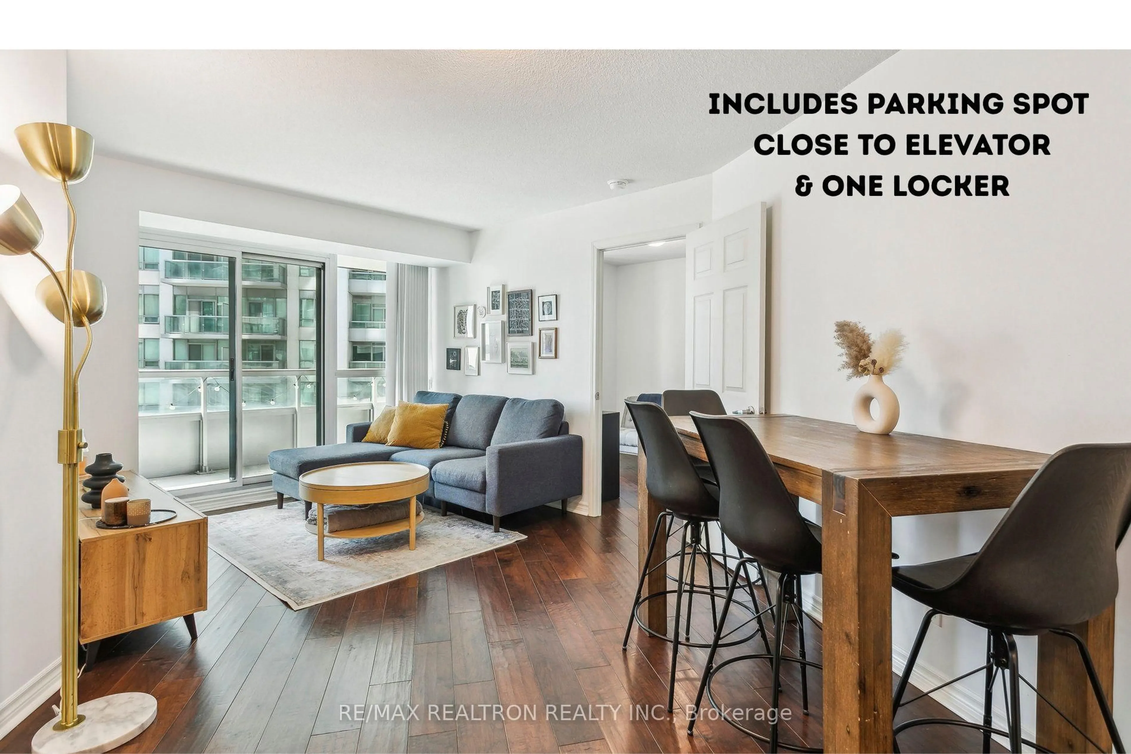 Living room with furniture, wood/laminate floor for 19 Grand Trunk Cres #1215, Toronto Ontario M5J 3A3