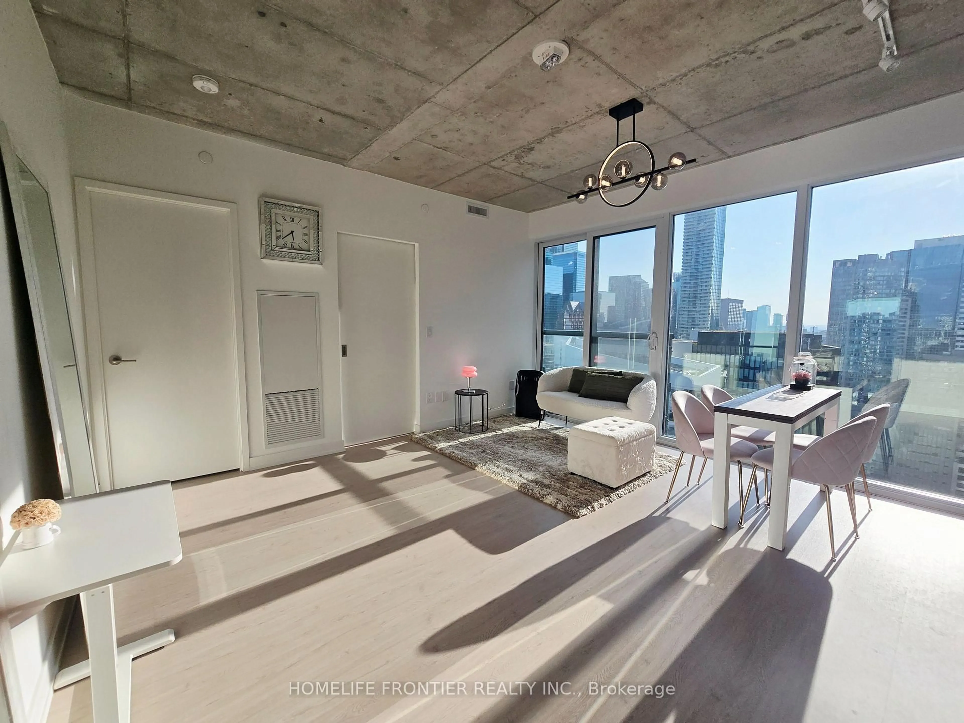 Living room with furniture, cement floor for 65 Mutual St #3004, Toronto Ontario M5B 2A9