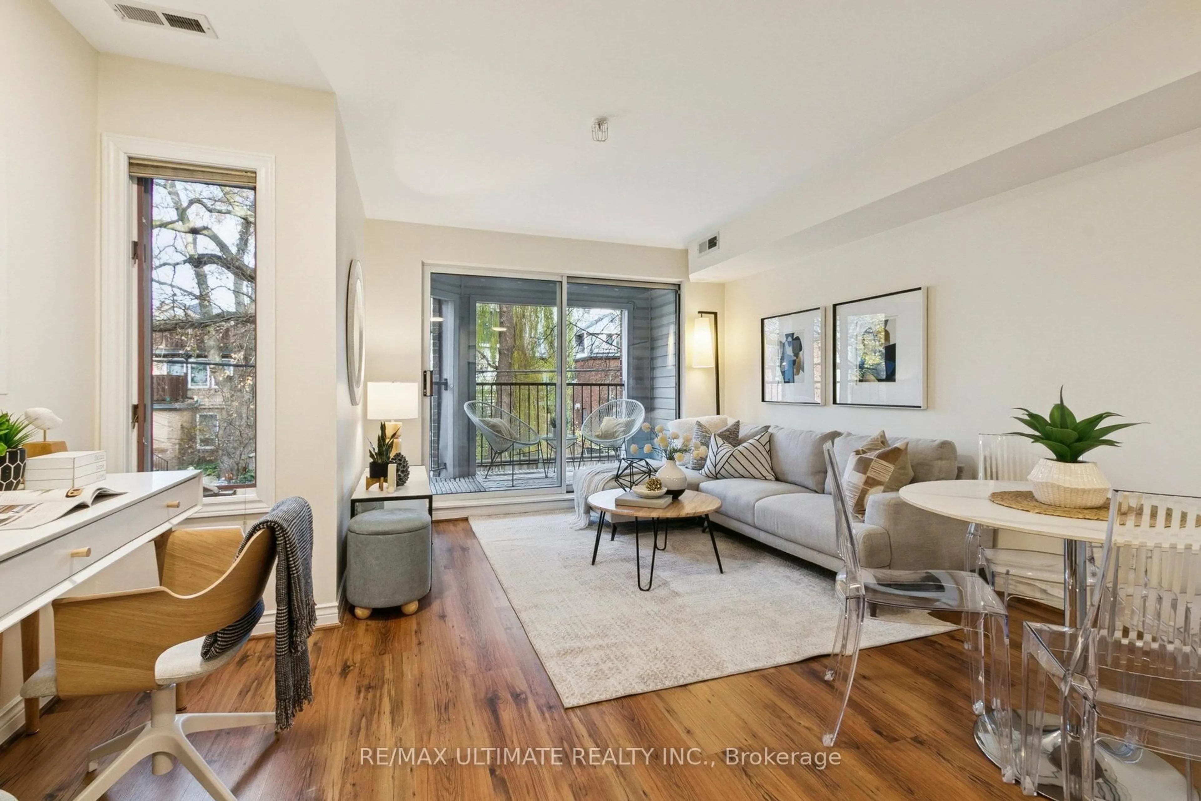 Living room with furniture, wood/laminate floor for 217 St. George St #31, Toronto Ontario M5R 3S7