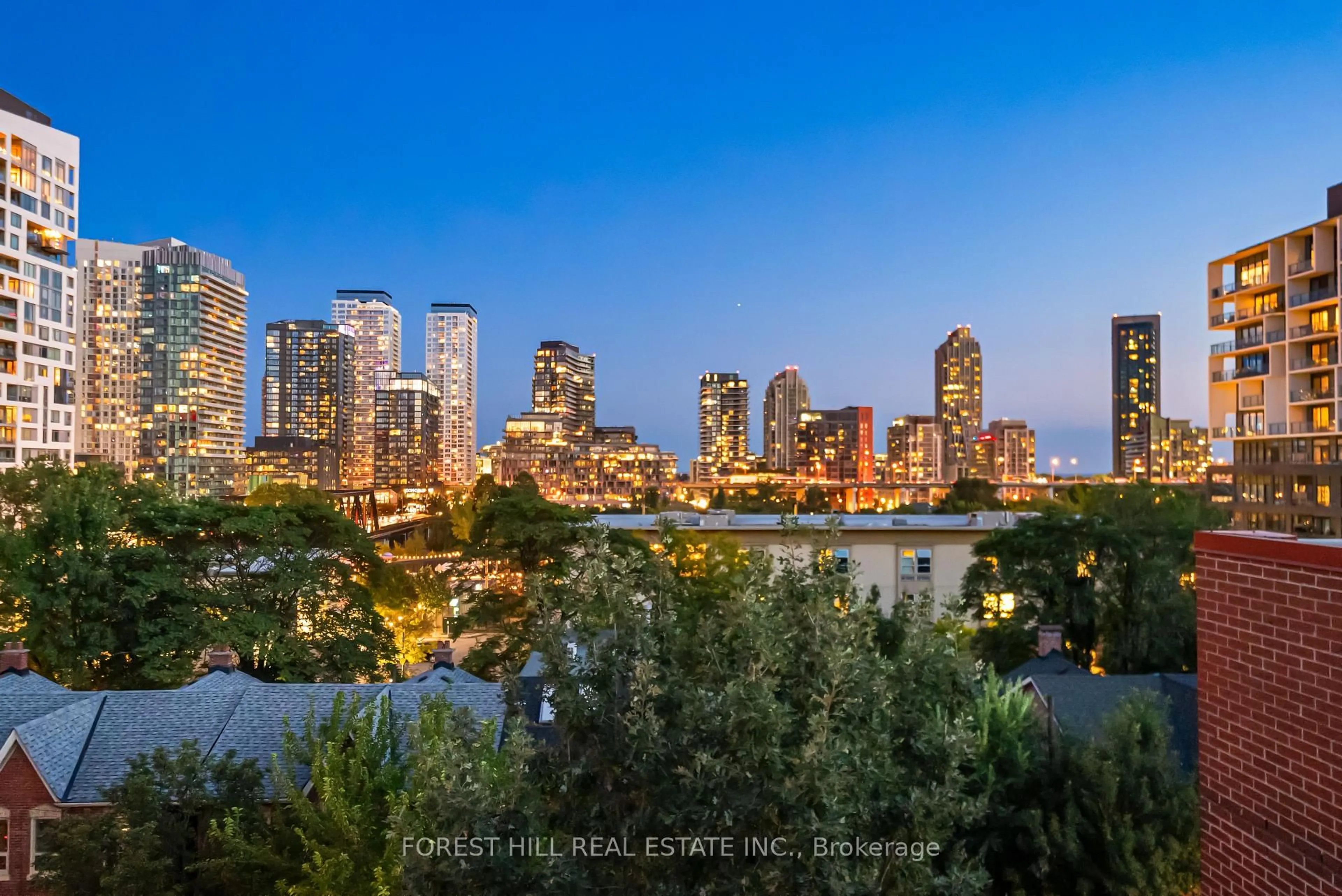 Patio, city buildings view from balcony for 62 Niagara St #519, Toronto Ontario M5V 1C5