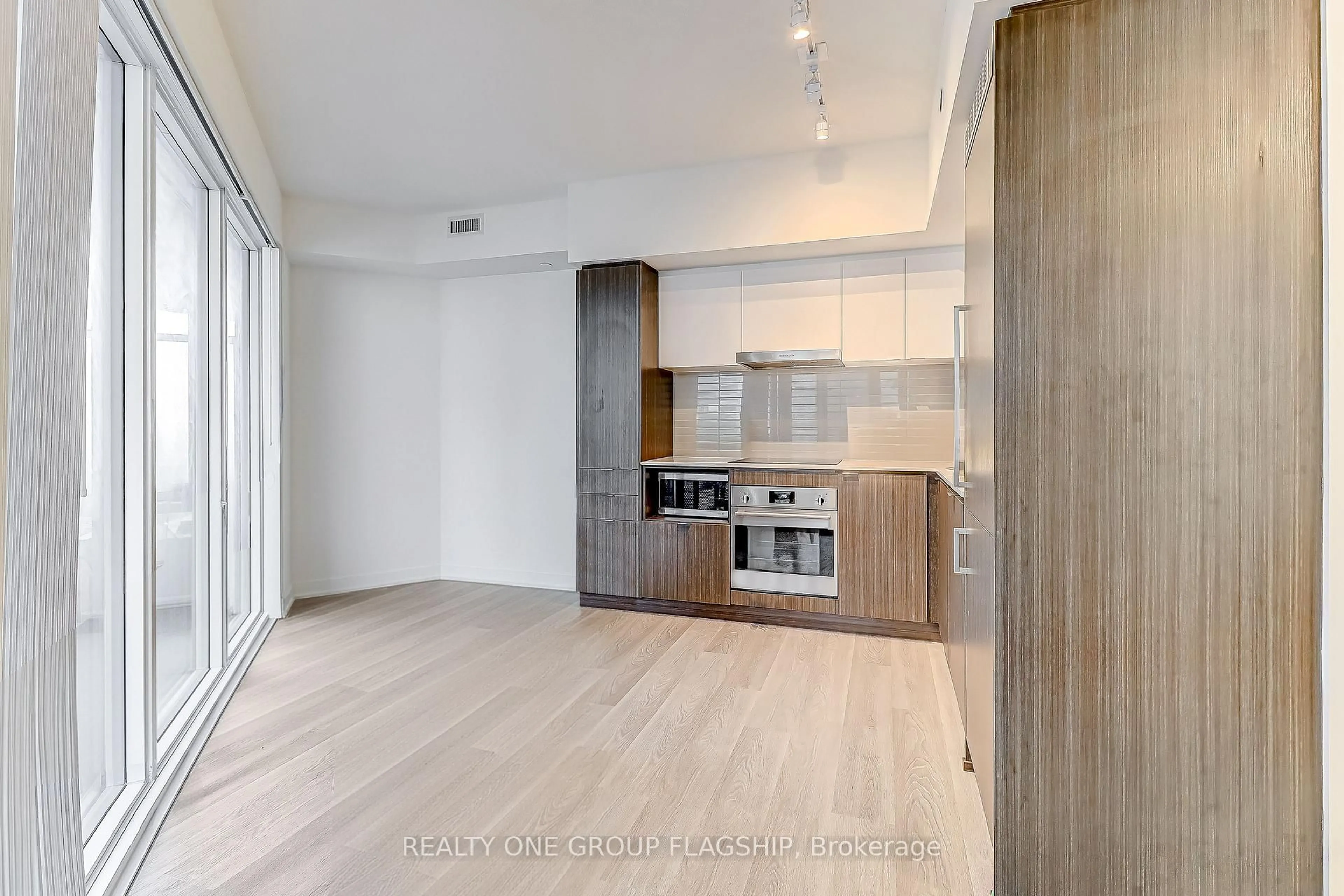 Open concept kitchen, wood/laminate floor for 55 Cooper St #3608, Toronto Ontario M5E 0G1