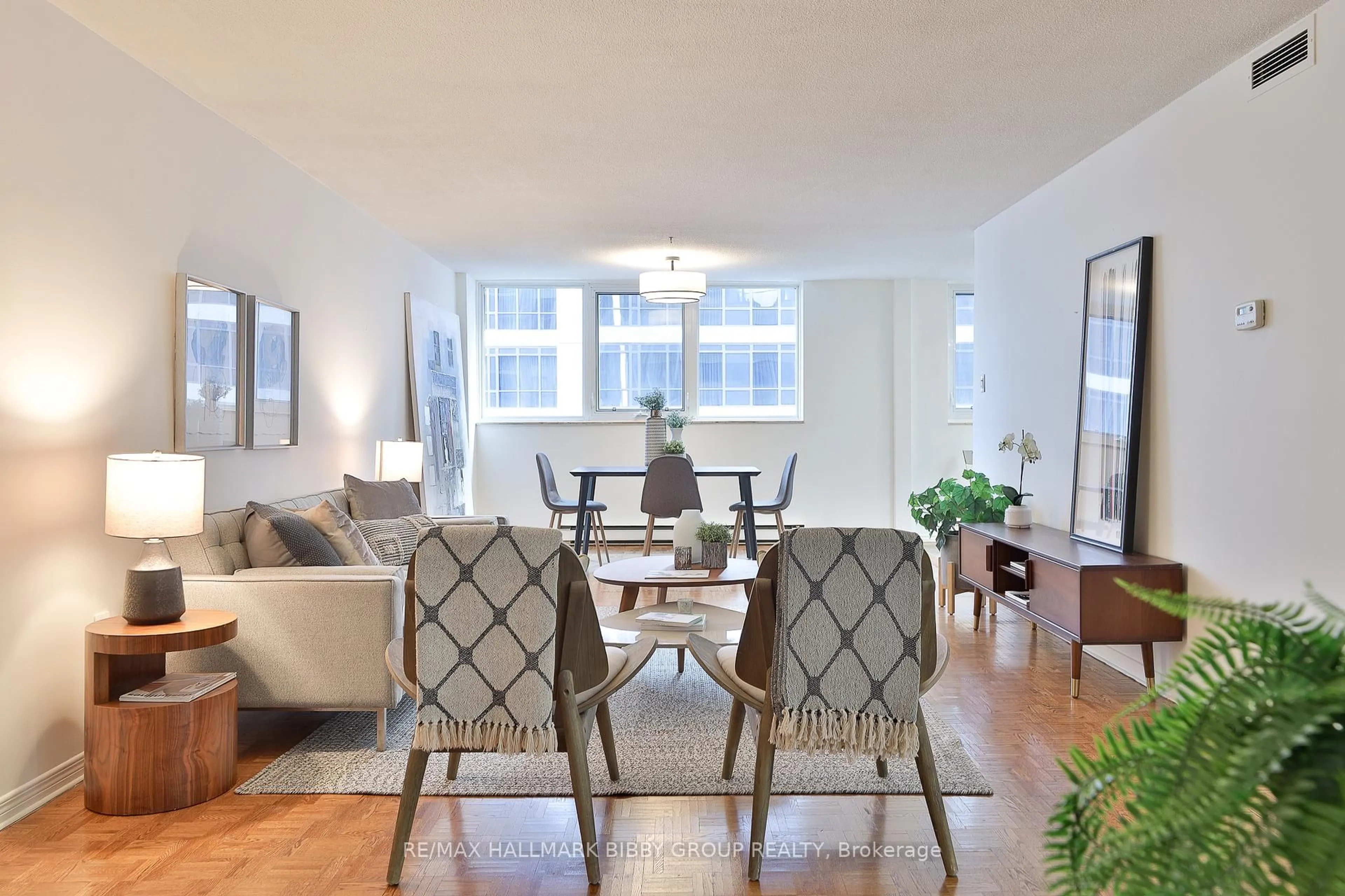 Living room with furniture, wood/laminate floor for 360 Bloor St #1007, Toronto Ontario M4W 3M3