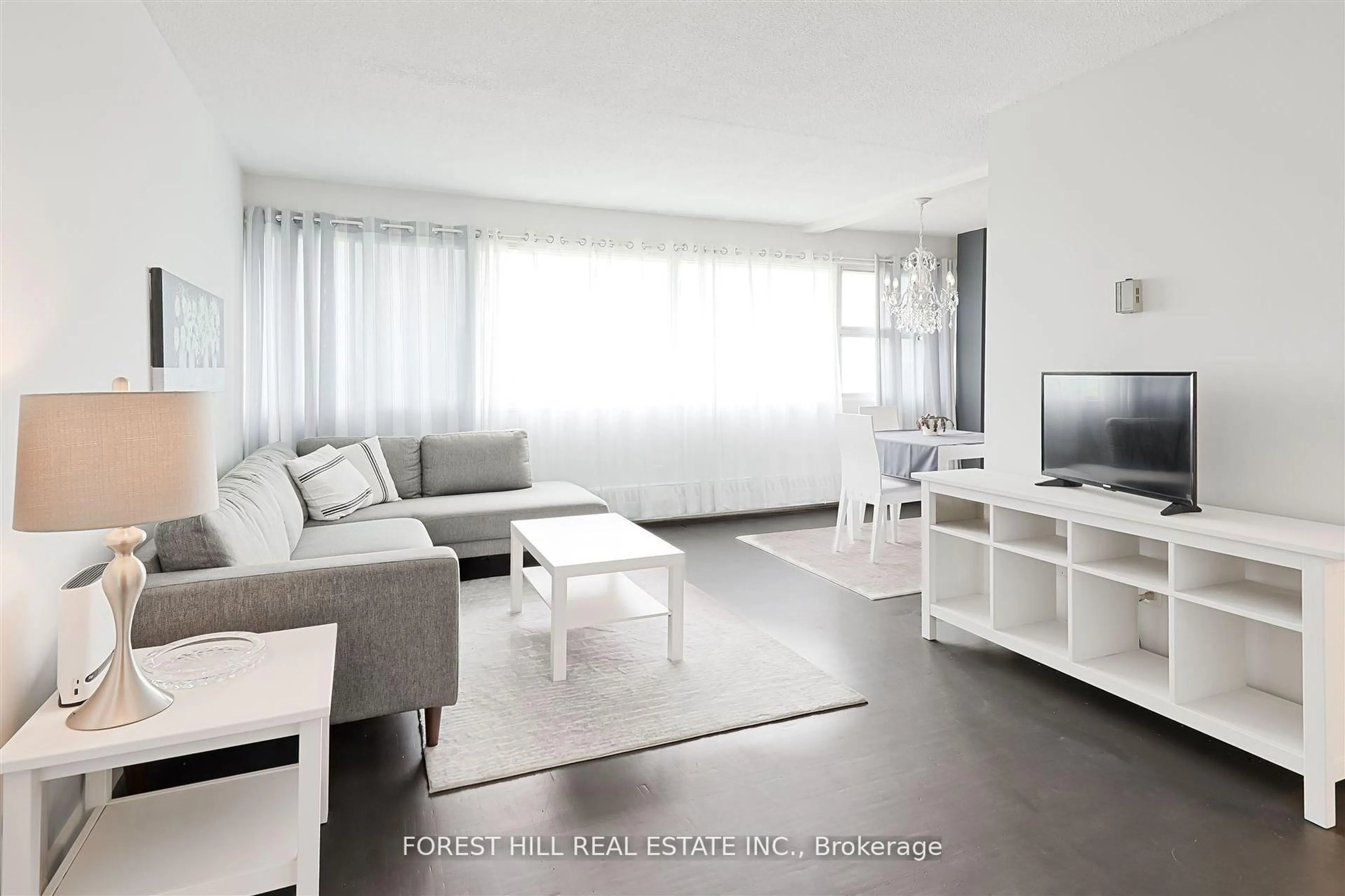 Living room with furniture, unknown for 725 Don Mills Rd #1701, Toronto Ontario M3C 1S8