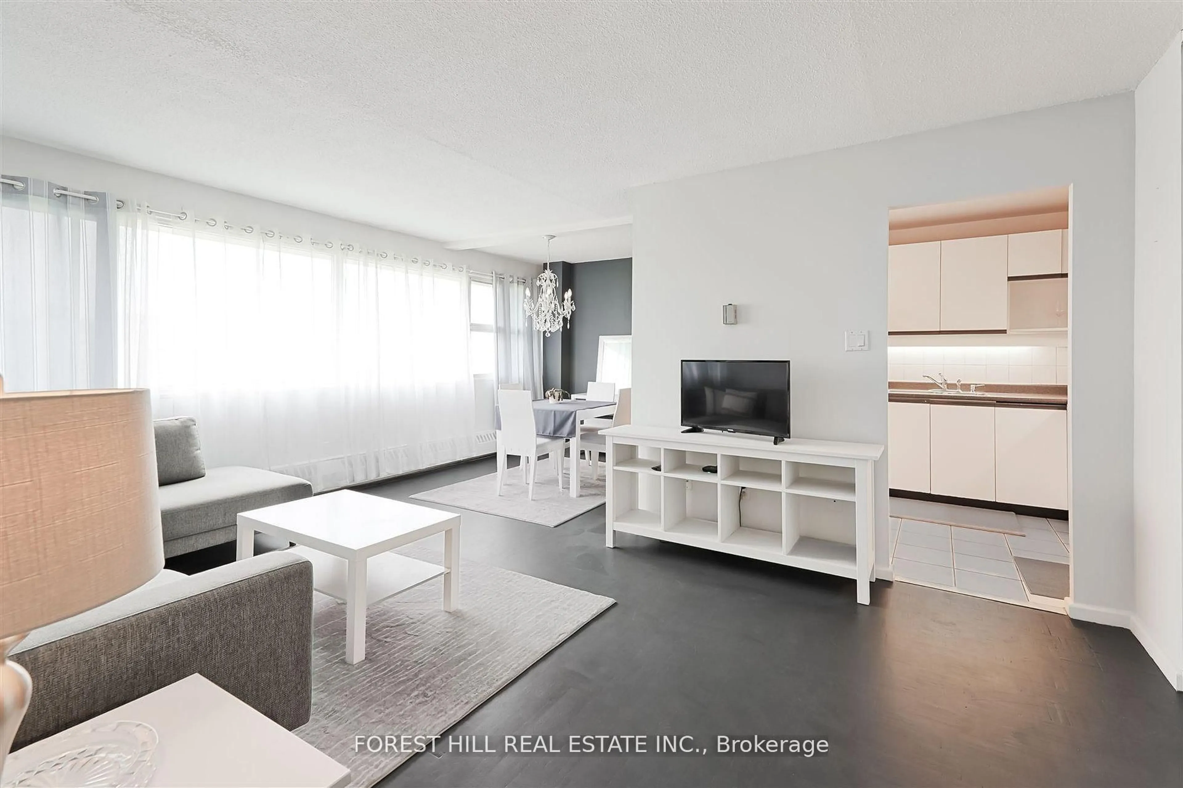 Living room with furniture, wood/laminate floor for 725 Don Mills Rd #1701, Toronto Ontario M3C 1S8