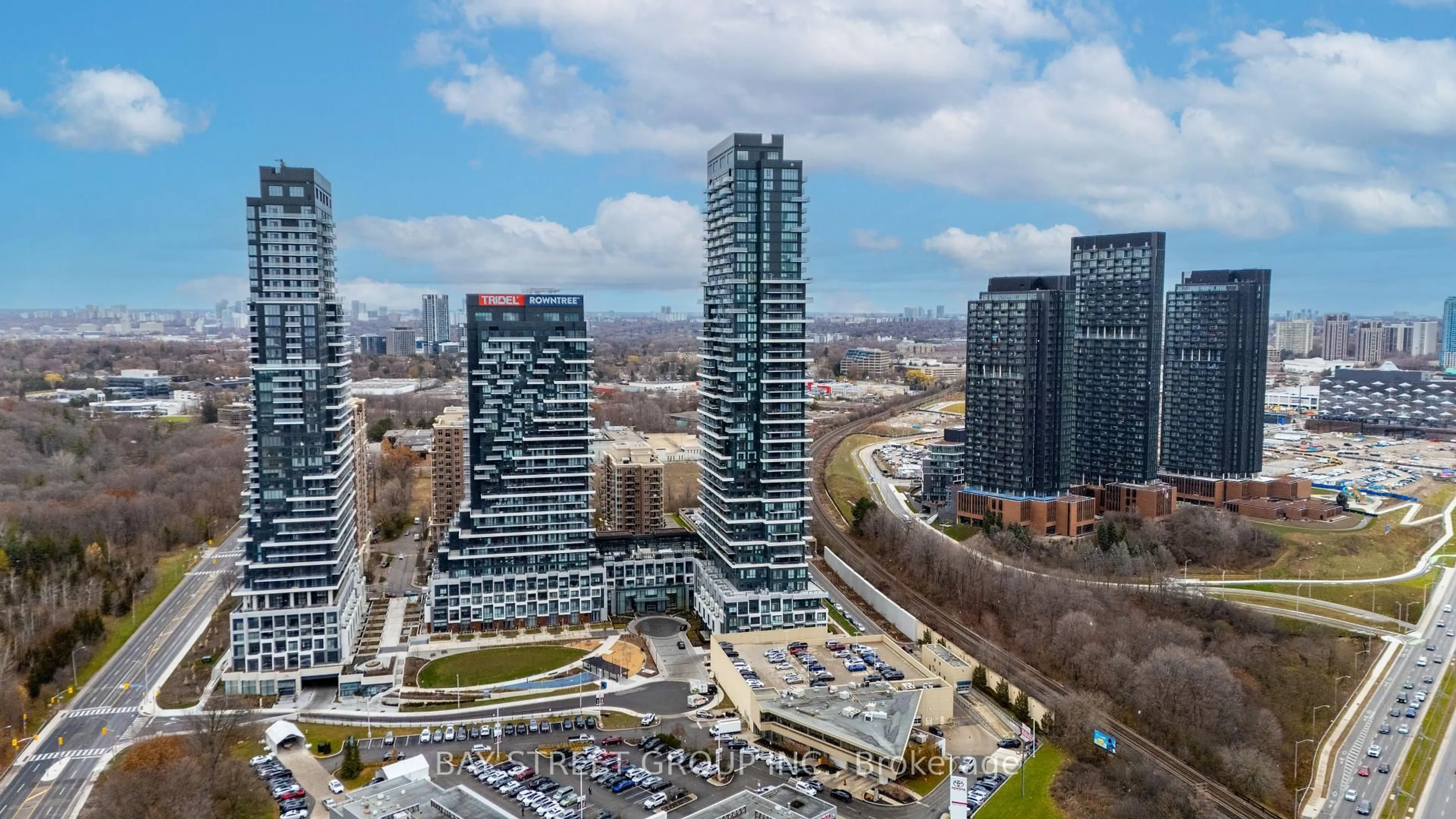 A pic from outside/outdoor area/front of a property/back of a property/a pic from drone, city buildings view from balcony for 30 Inn on the Park Dr #315, Toronto Ontario M3C 0P8