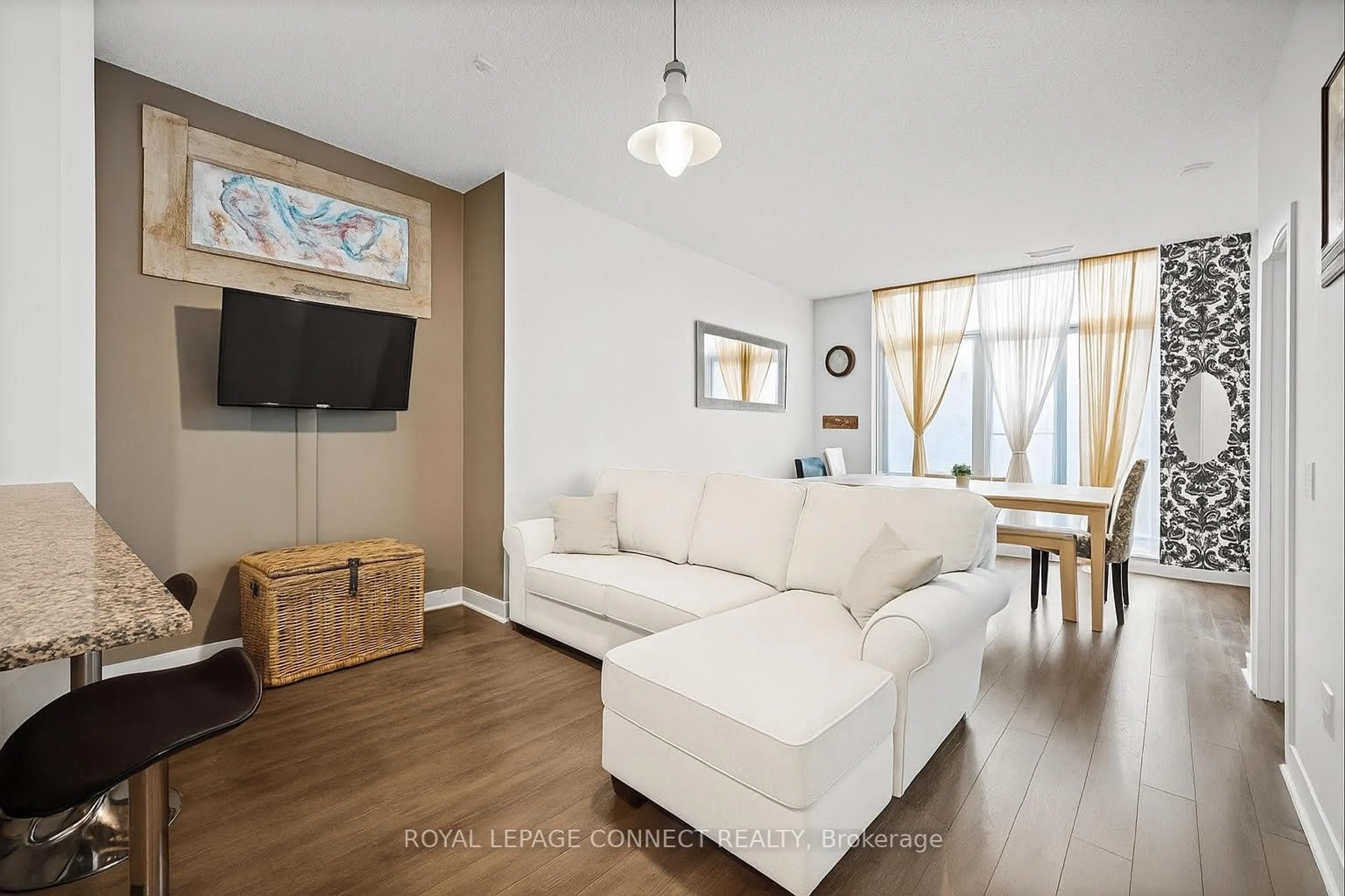 Living room with furniture, wood/laminate floor for 525 Wilson Ave #147, Toronto Ontario M3H 0A7