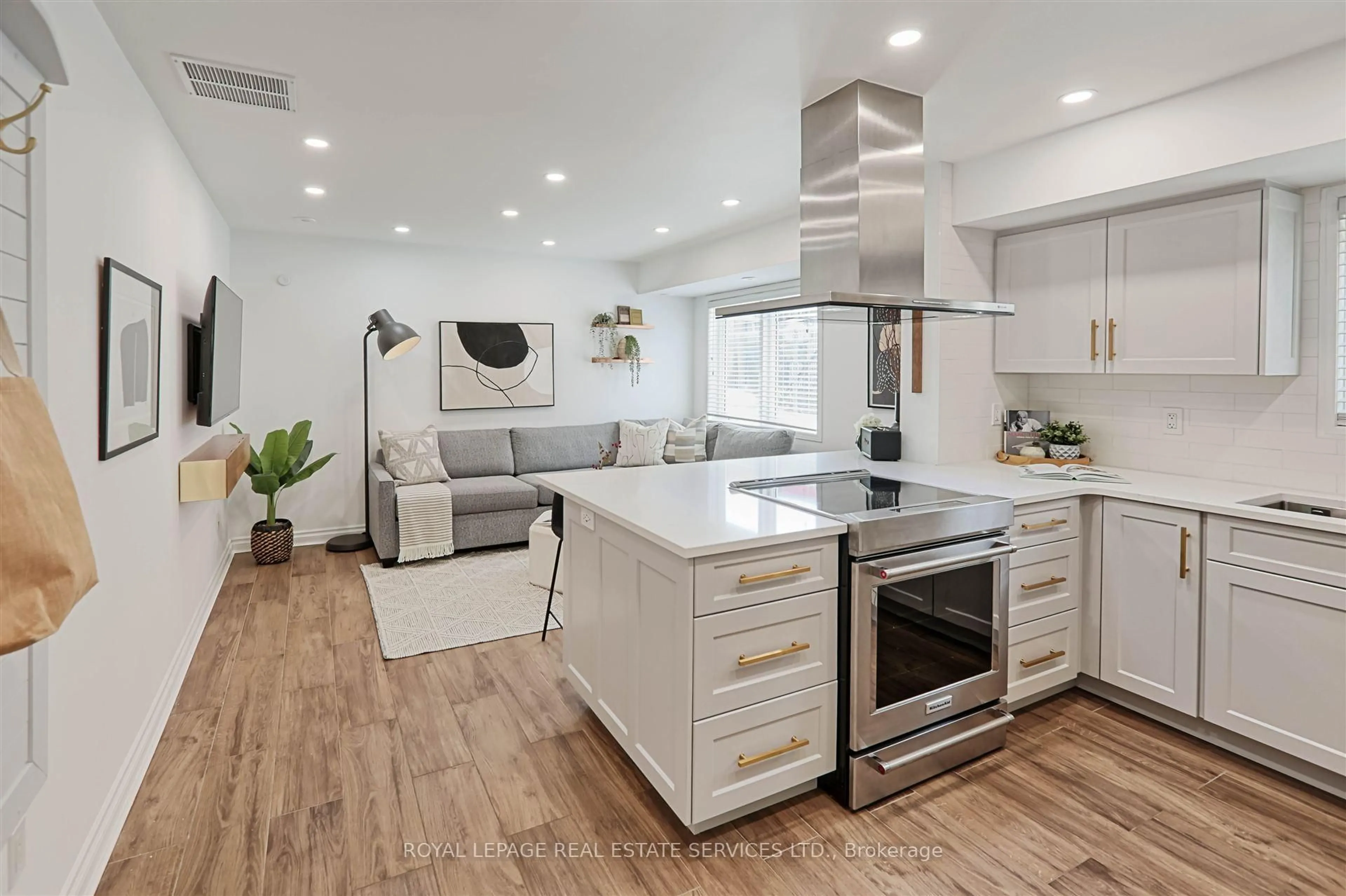 Open concept kitchen, wood/laminate floor for 40 Merchant Lane #113, Toronto Ontario M6P 4J6