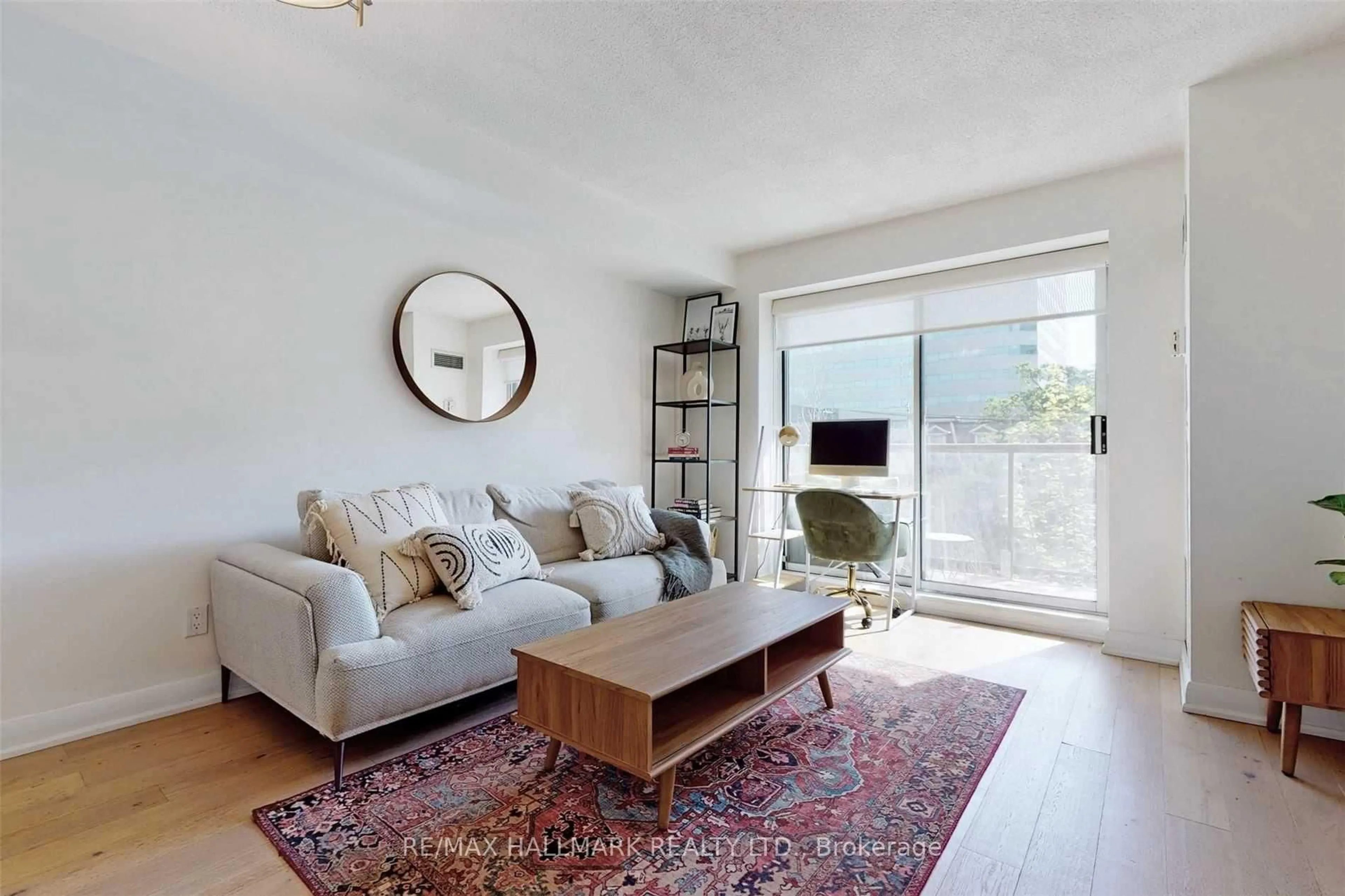 Living room with furniture, wood/laminate floor for 140 Bathurst St #408, Toronto Ontario M5V 3N8