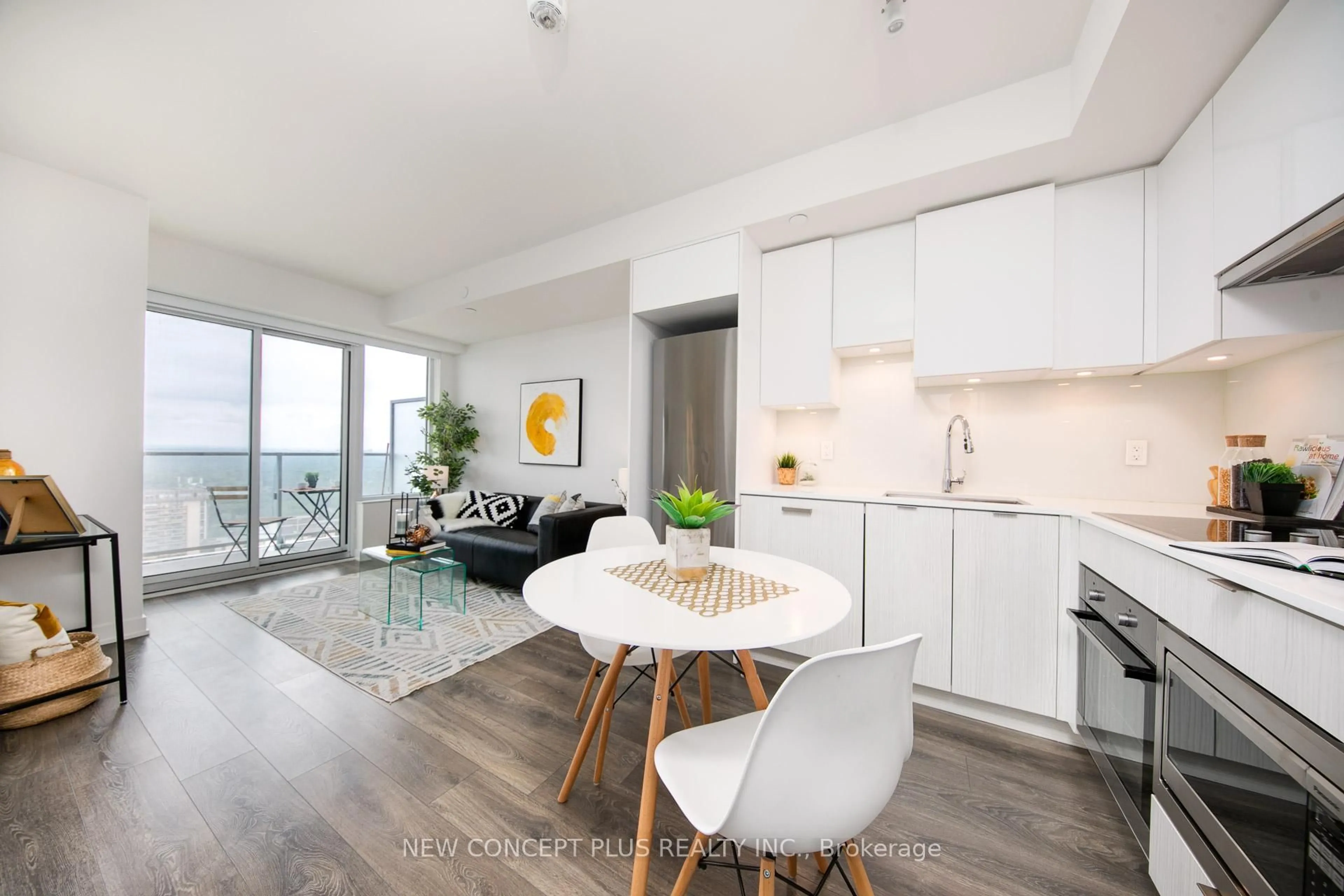 Open concept kitchen, wood/laminate floor for 99 Broadway Ave #3302, Toronto Ontario M4P 0E3