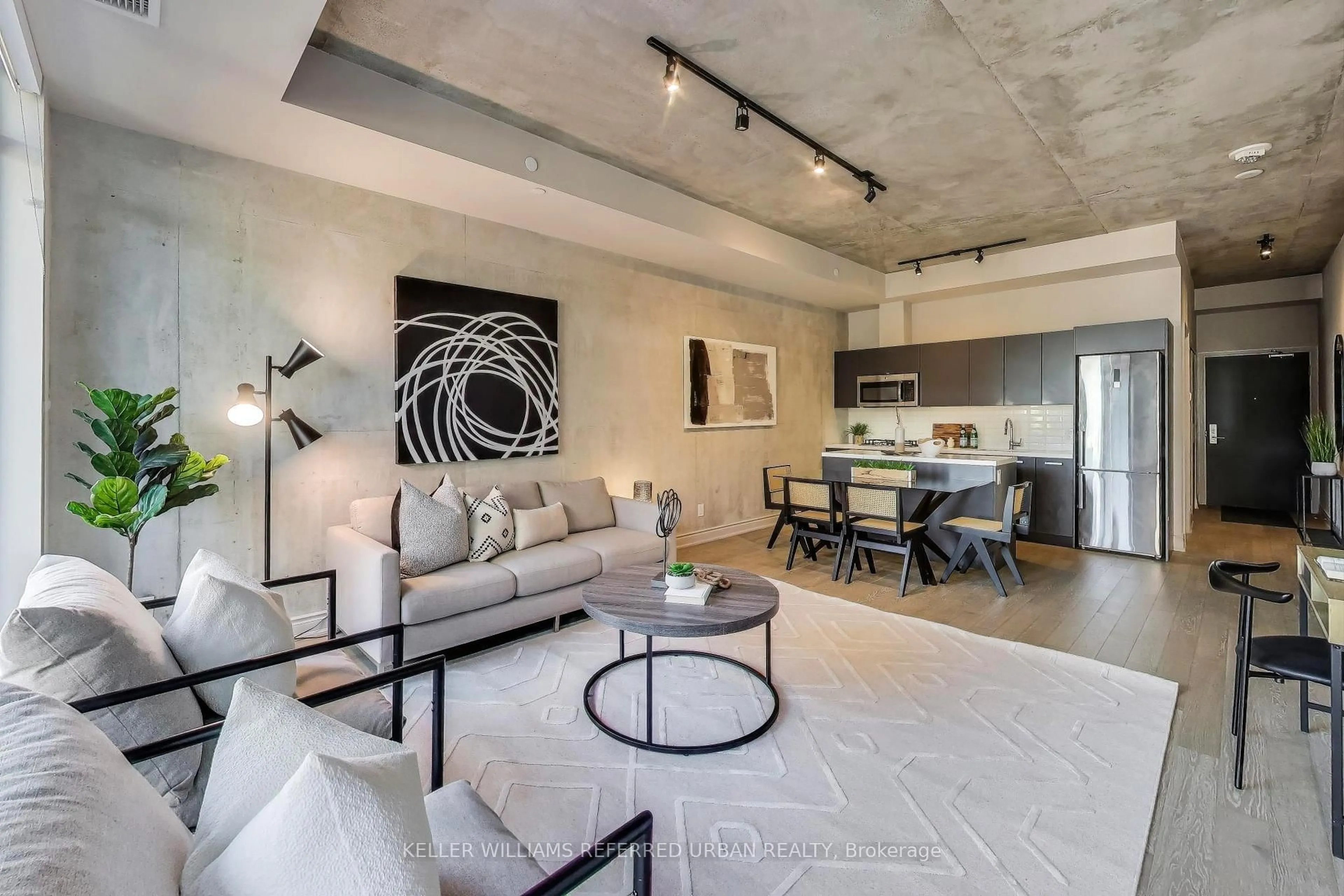 Living room with furniture, cement floor for 608 Richmond St #616, Toronto Ontario M5V 0N9