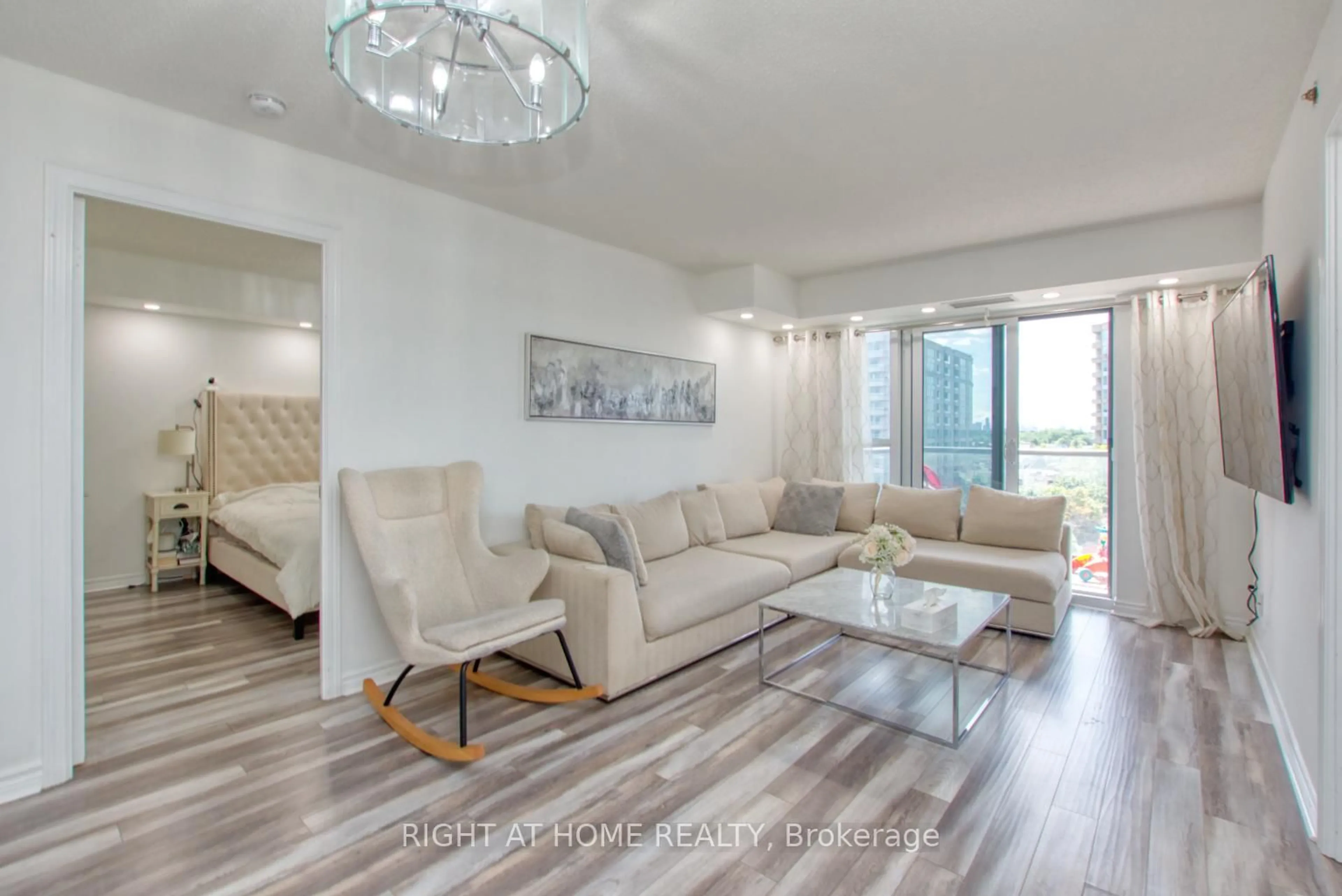 Living room with furniture, wood/laminate floor for 35 Saranac Blvd #827, Toronto Ontario M6A 2G4