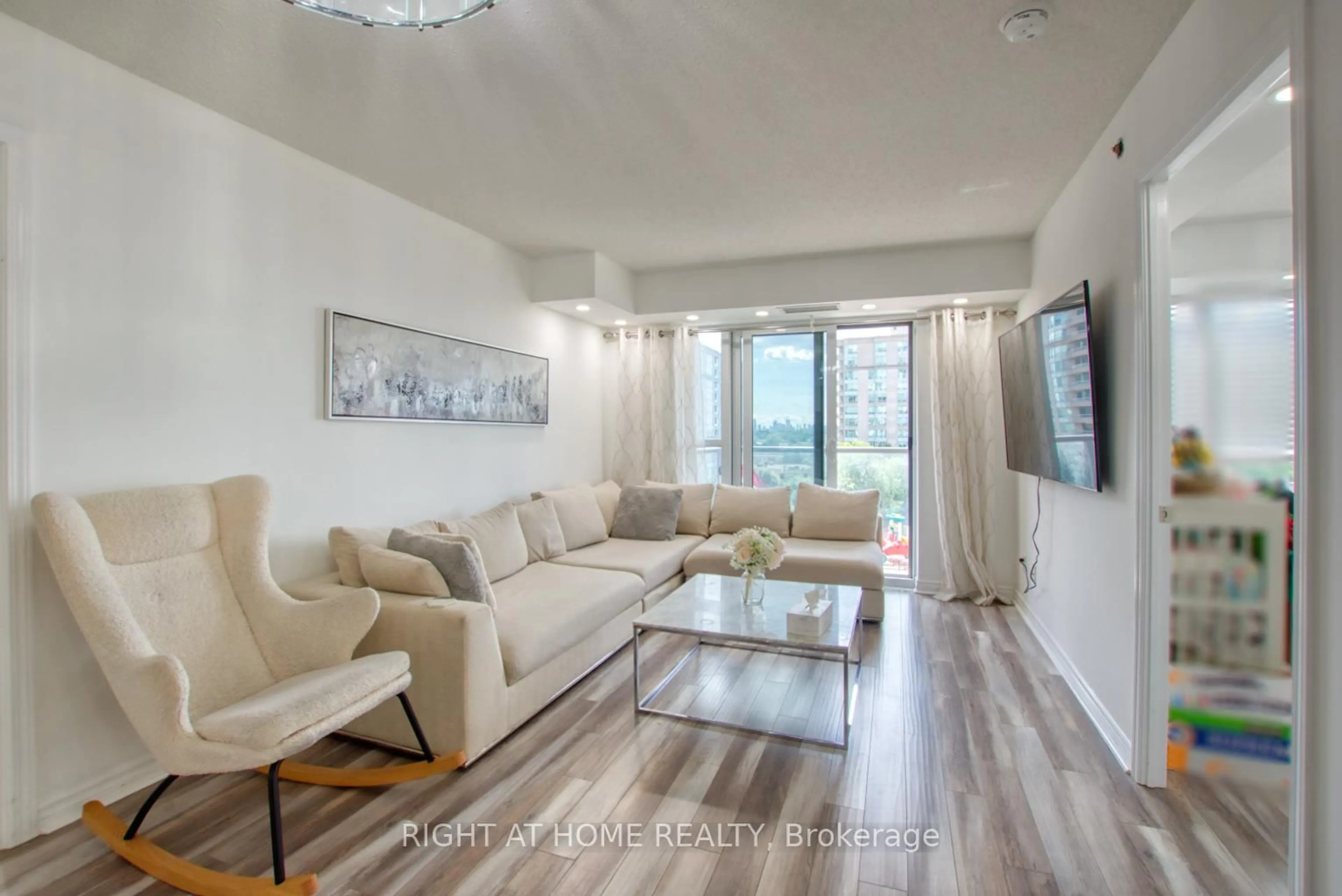 Living room with furniture, wood/laminate floor for 35 Saranac Blvd #827, Toronto Ontario M6A 2G4