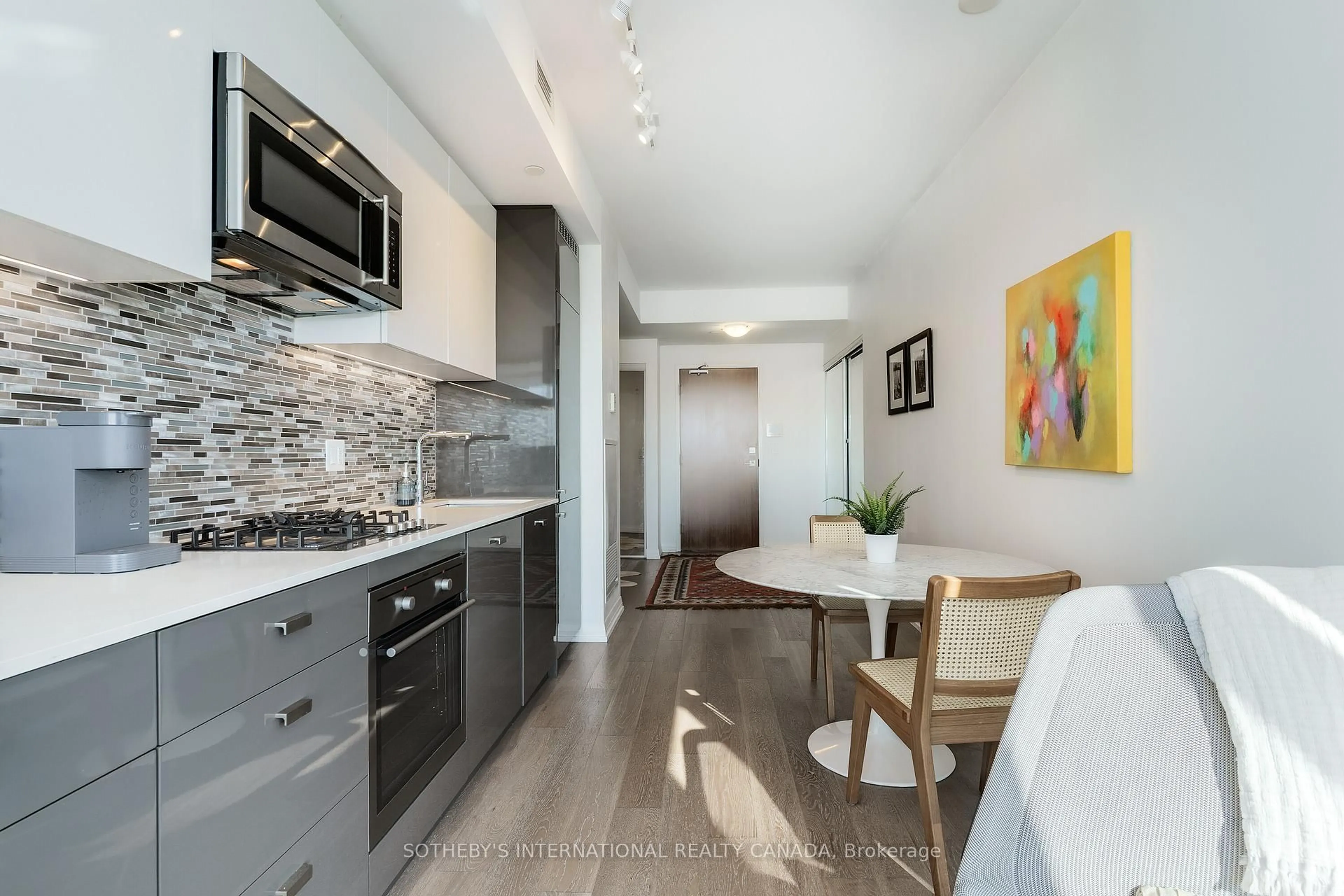 Open concept kitchen, ceramic/tile floor for 835 St. Clair Ave #707, Toronto Ontario M6C 0A8