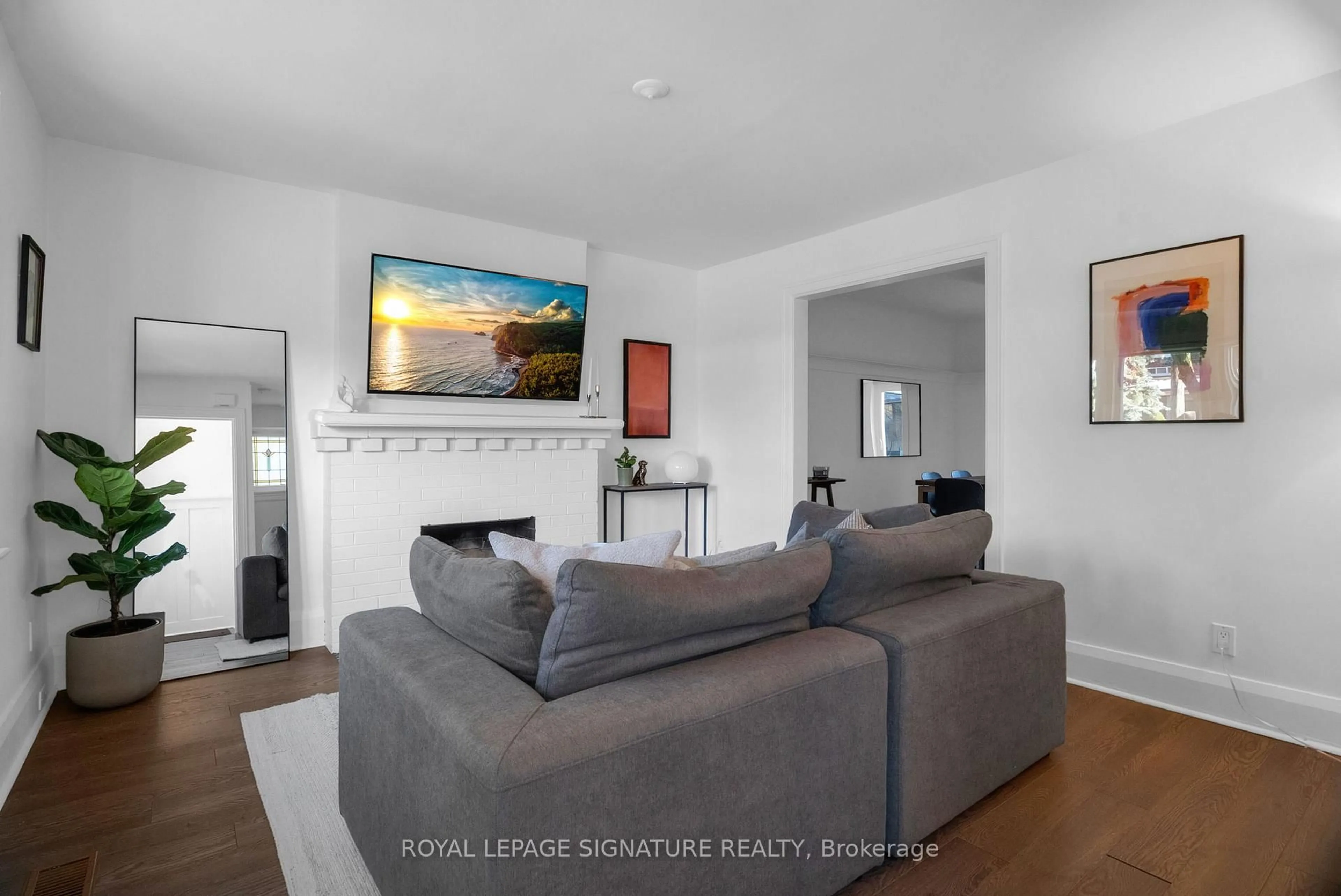 Living room with furniture, wood/laminate floor for 303 Forman Ave, Toronto Ontario M4S 2S6