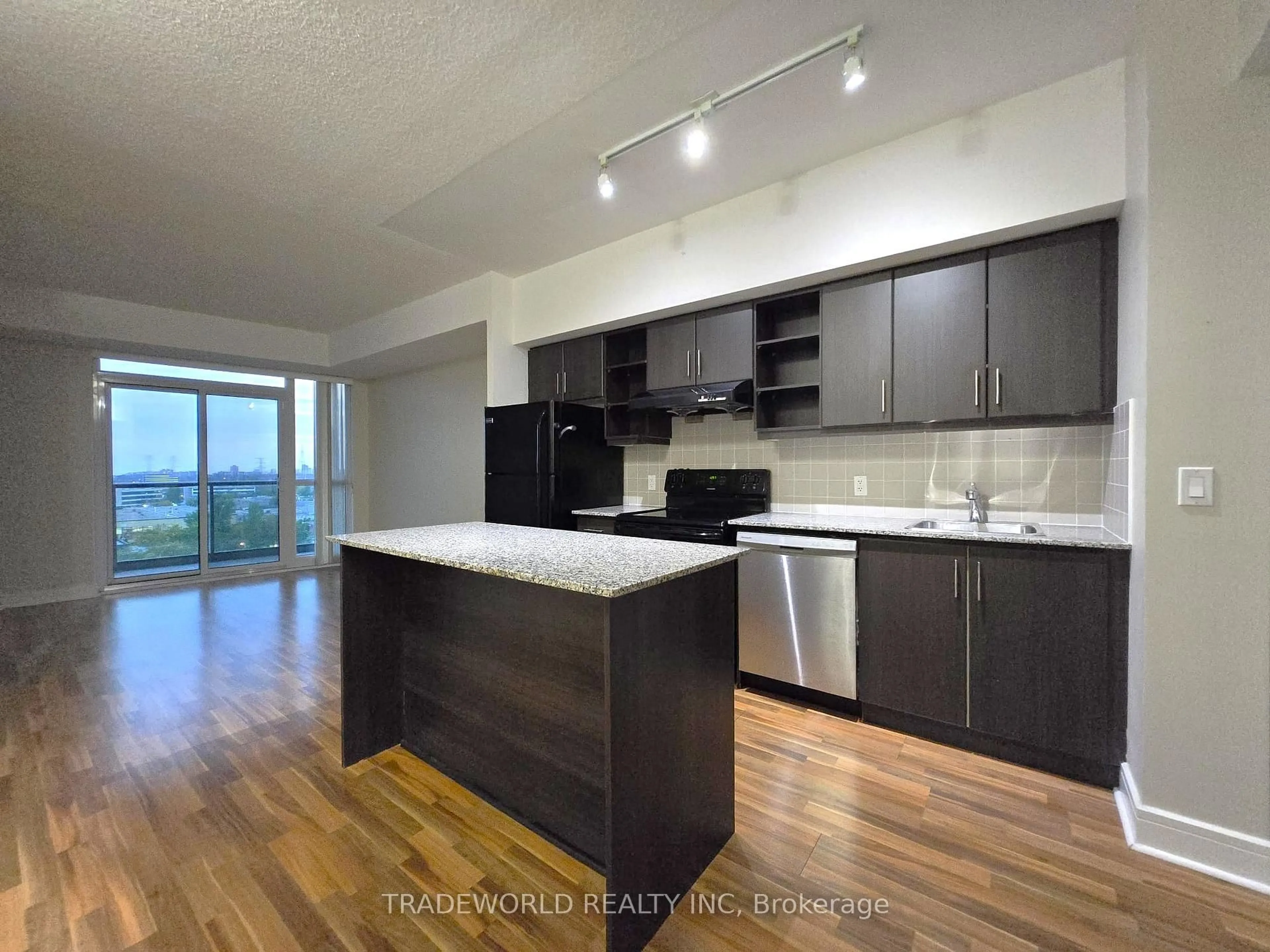 Open concept kitchen, wood/laminate floor for 35 Brian Peck Cres #1016, Toronto Ontario M4G 0A5