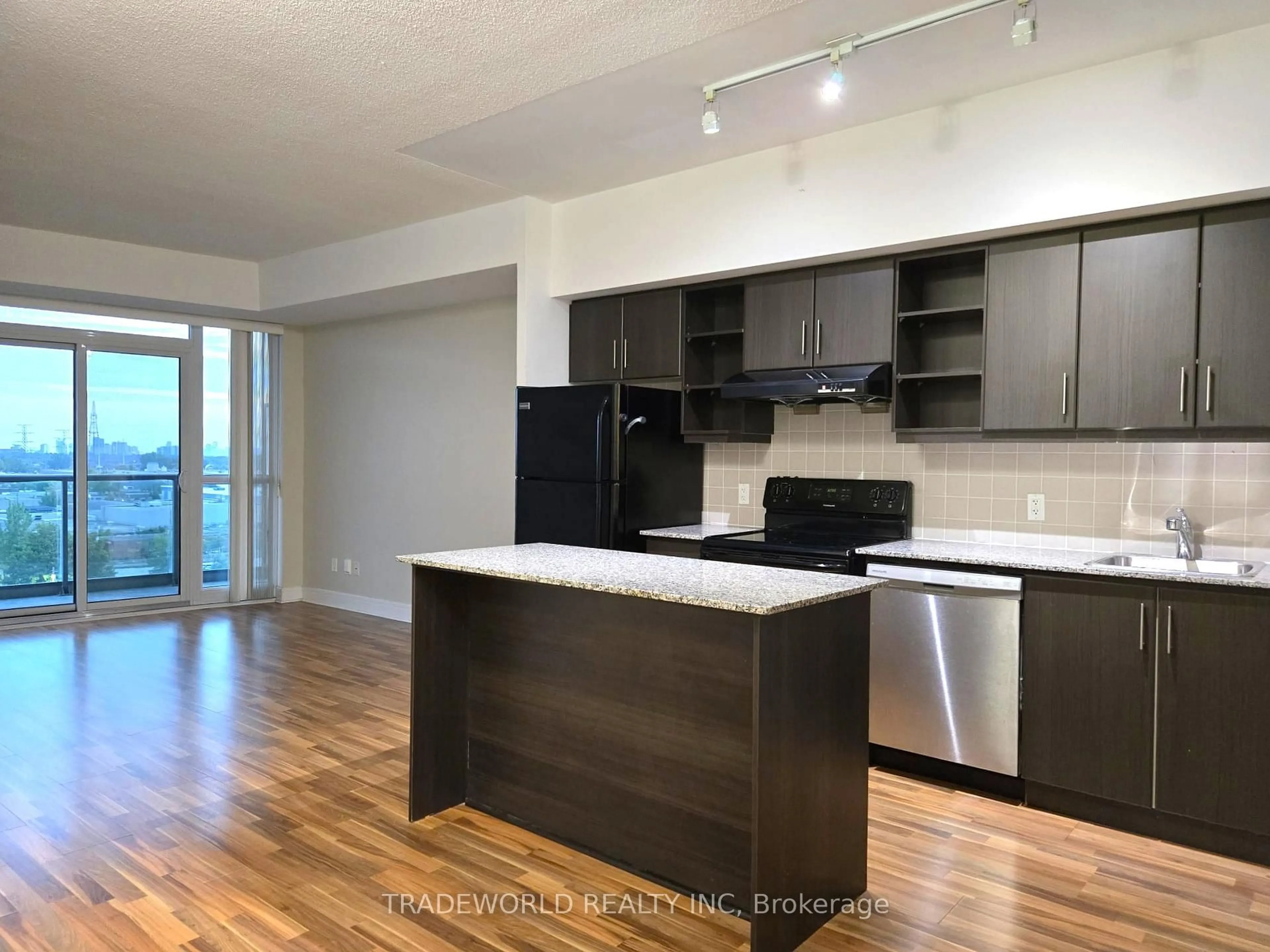 Open concept kitchen, wood/laminate floor for 35 Brian Peck Cres #1016, Toronto Ontario M4G 0A5