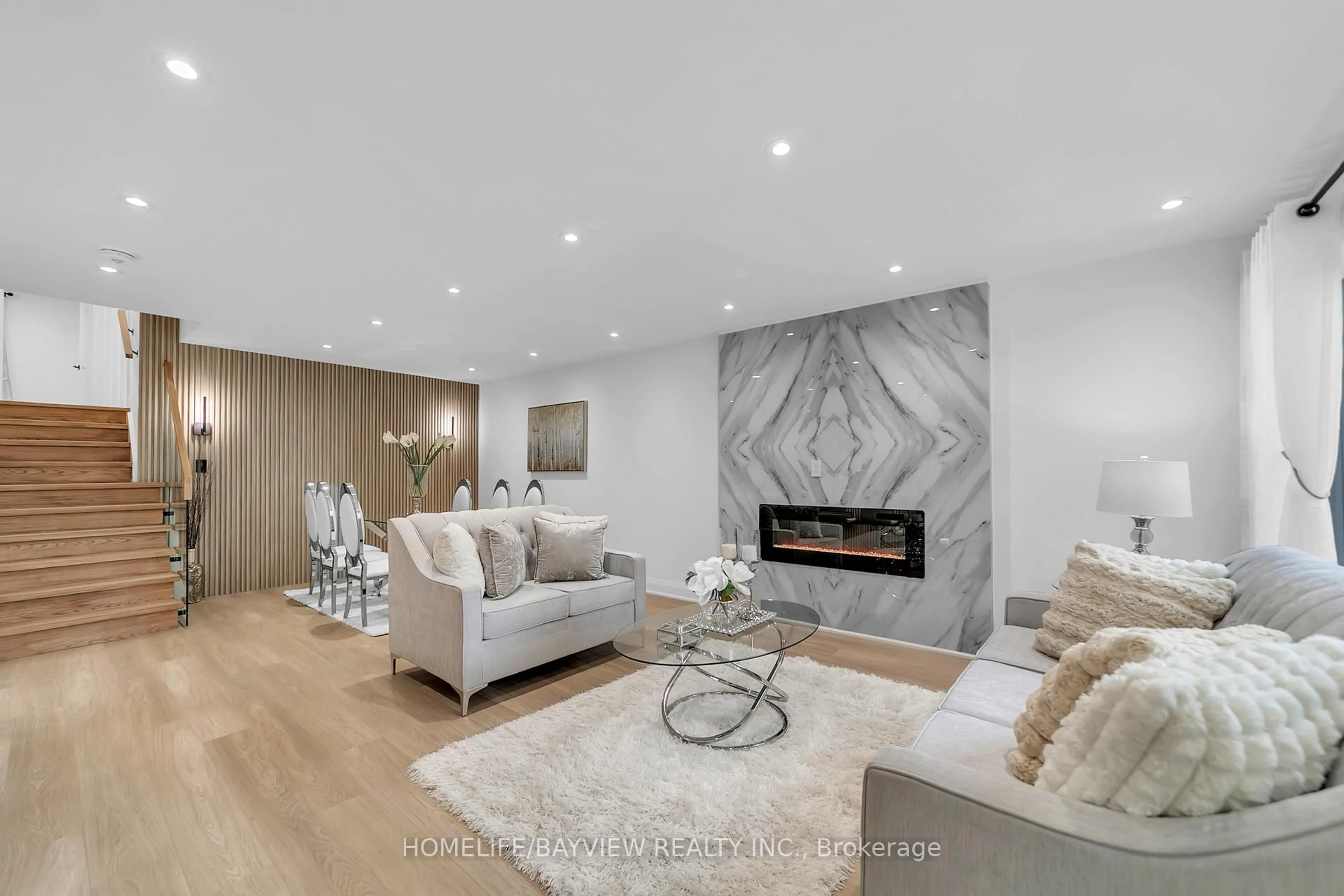 Living room with furniture, wood/laminate floor for 78 Clancy Dr, Toronto Ontario M2J 2V8