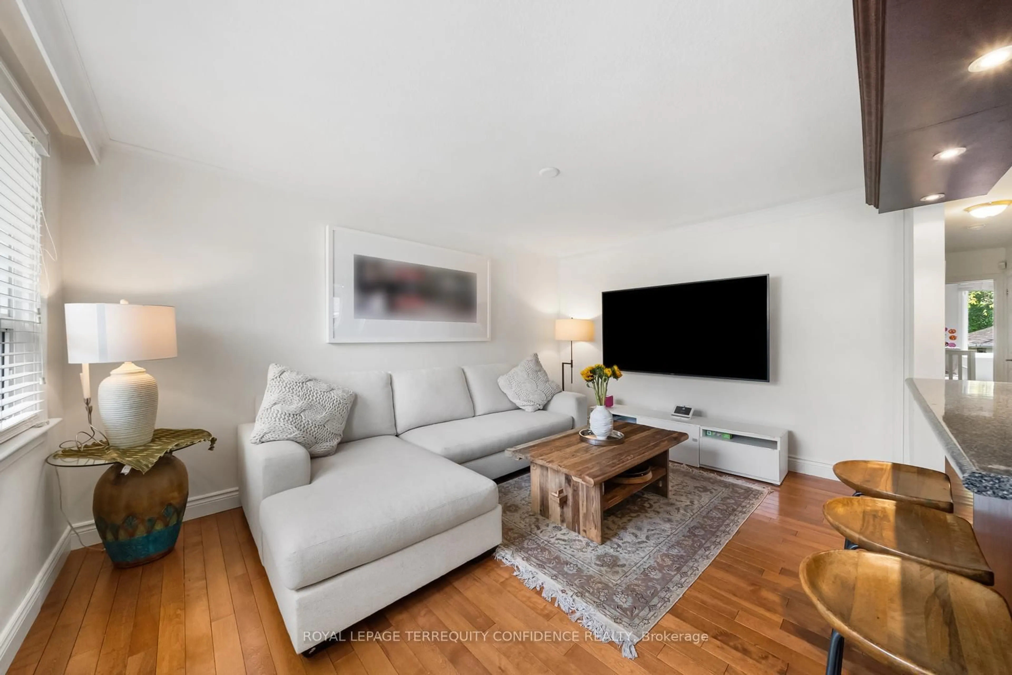 Living room with furniture, wood/laminate floor for 69 Nipigon Ave, Toronto Ontario M2M 2V9