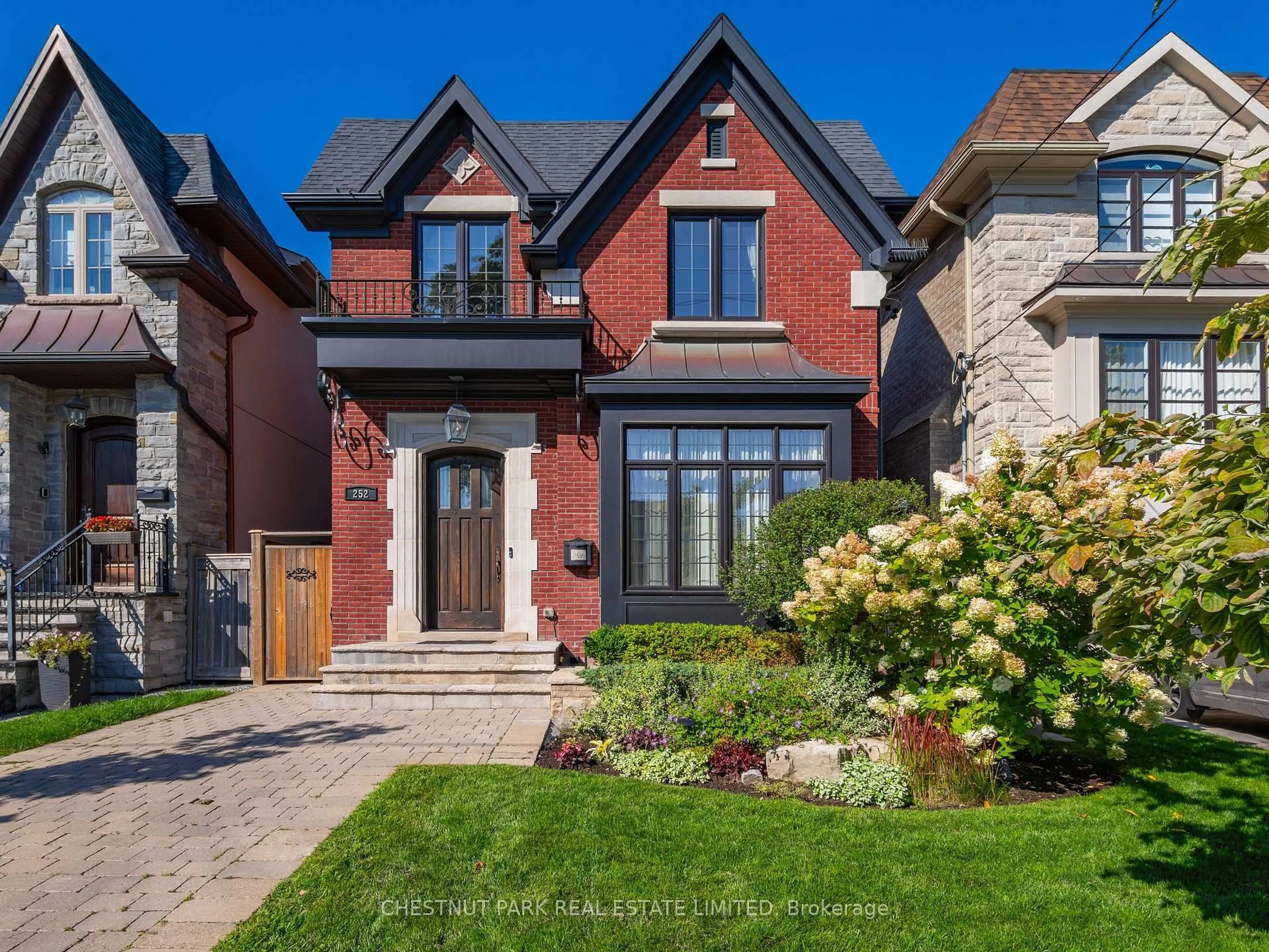 Home with brick exterior material, street for 252 Sutherland Dr, Toronto Ontario M4G 1J3
