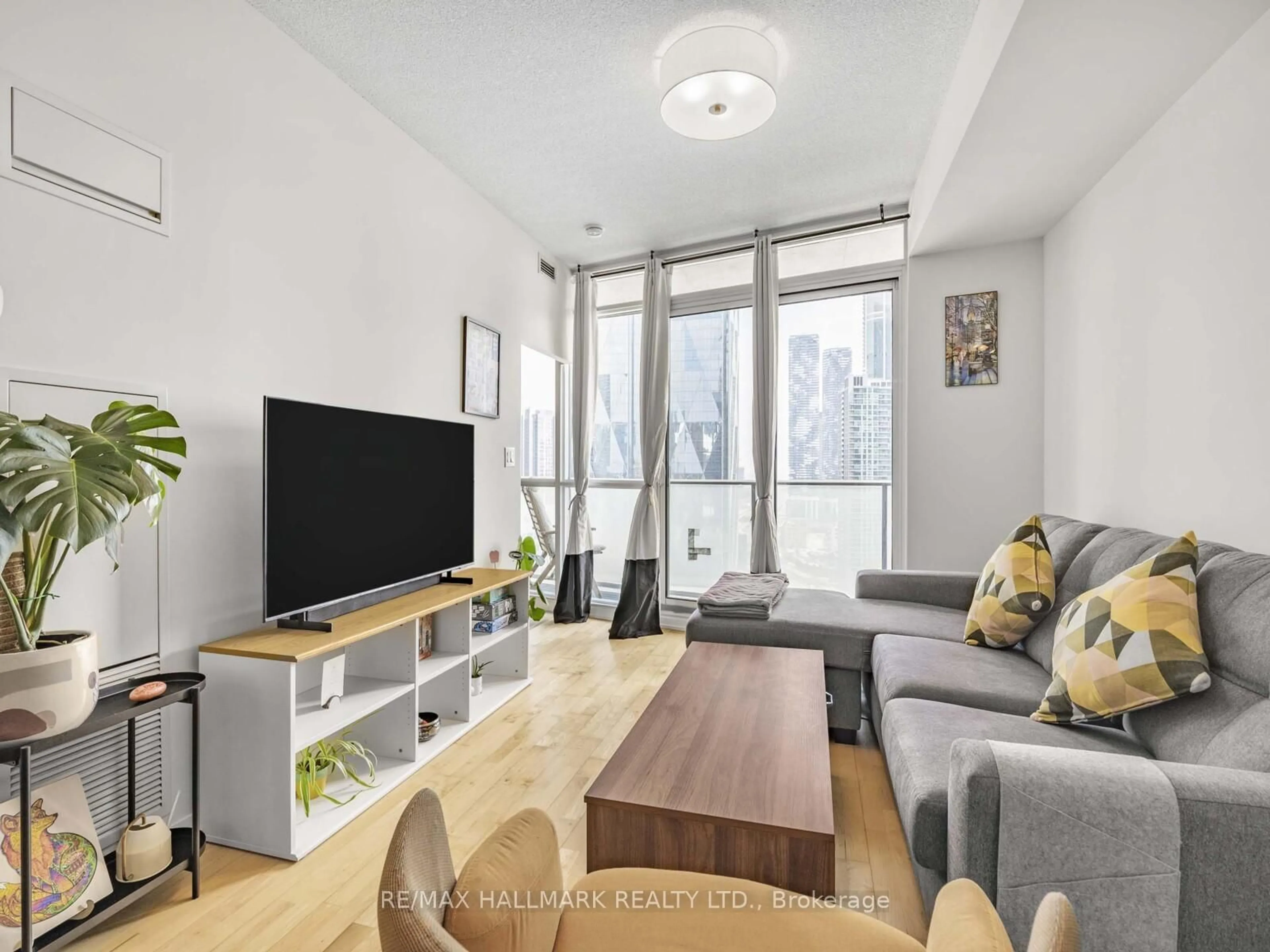 Living room with furniture, unknown for 65 Bremner Blvd #2109, Toronto Ontario M5J 0A7