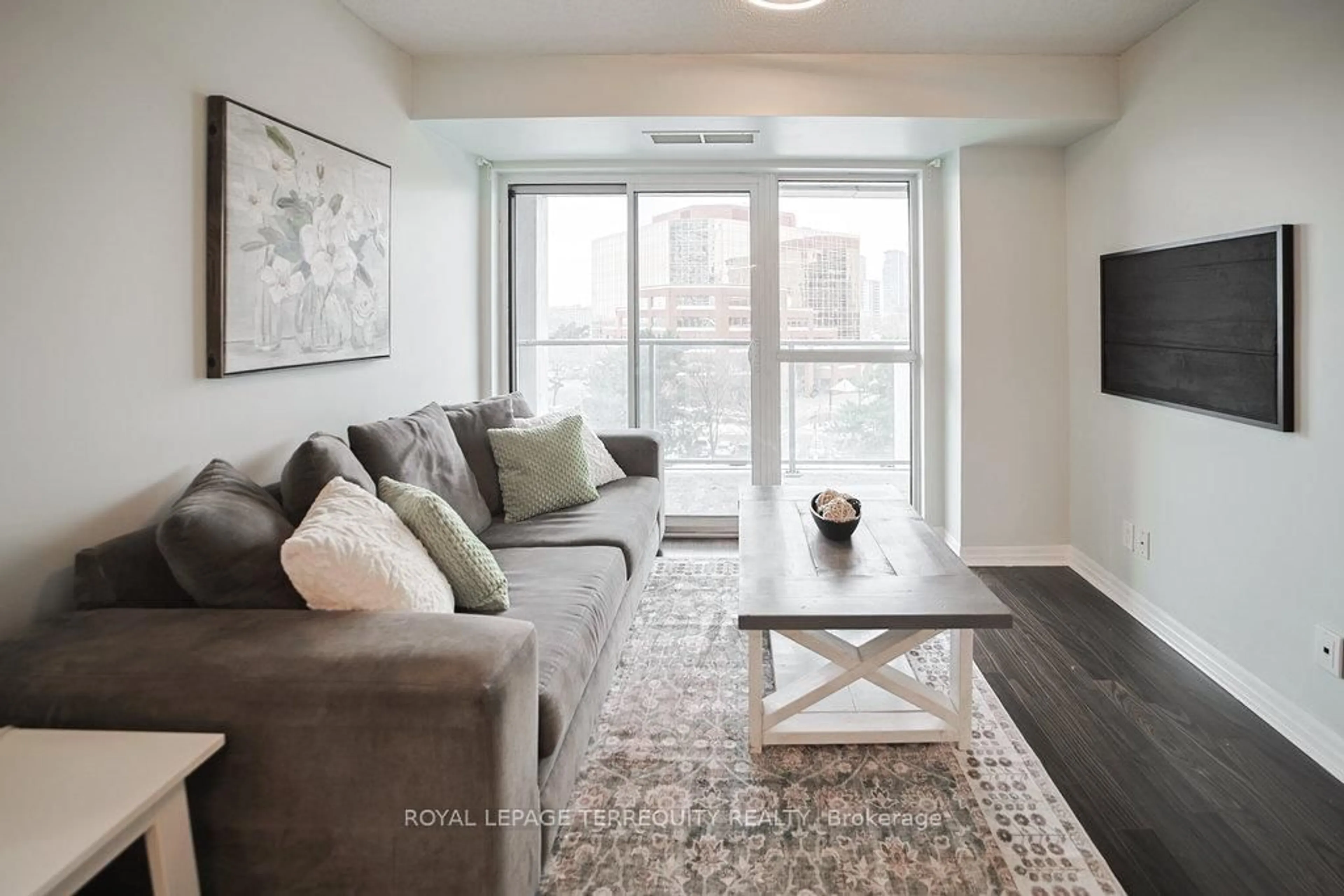 Living room with furniture, wood/laminate floor for 275 Yorkland Rd #411, Toronto Ontario M2J 0B4