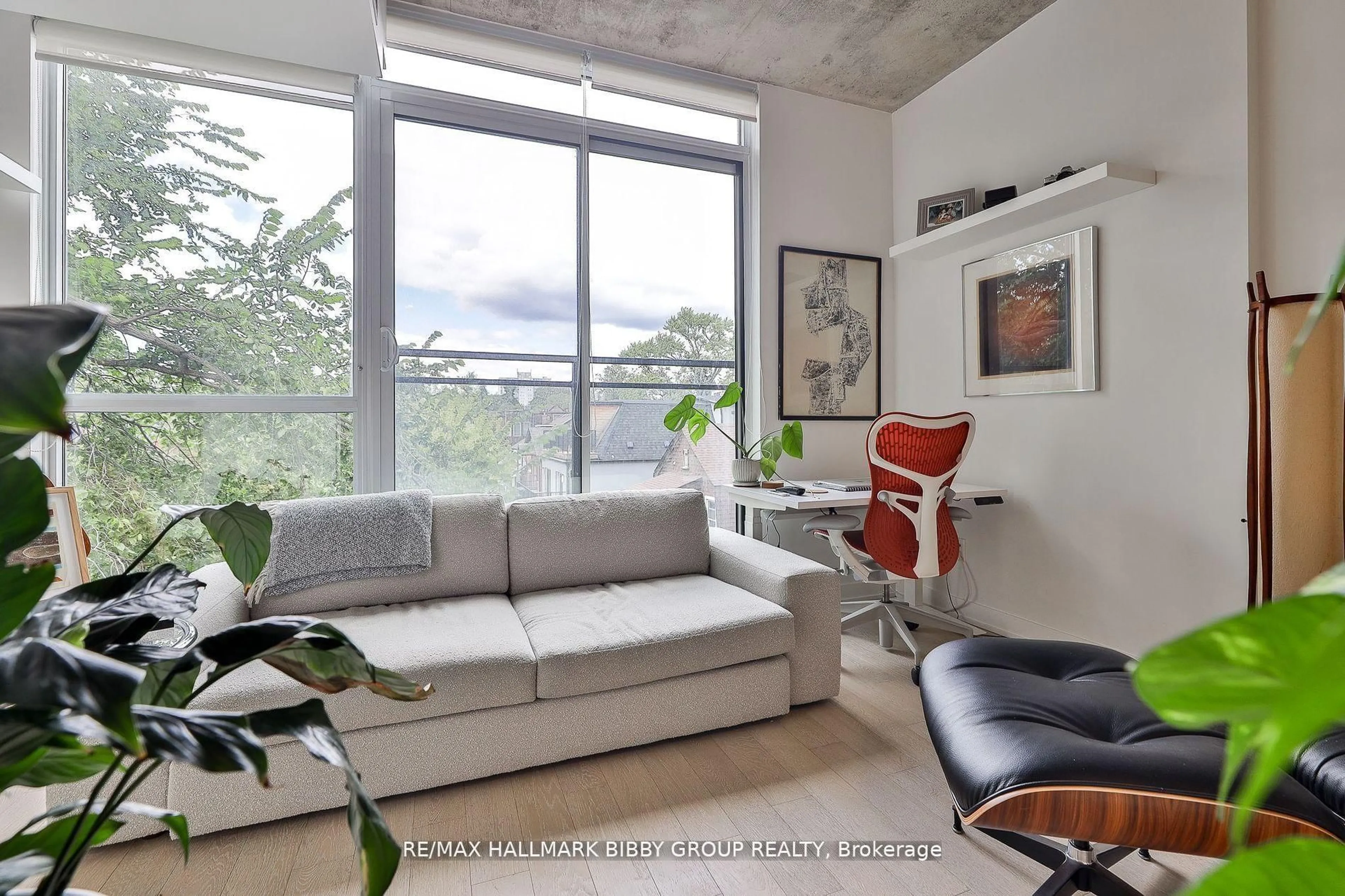 Living room with furniture, cement floor for 130 Rusholme Rd #309, Toronto Ontario M6H 1A7