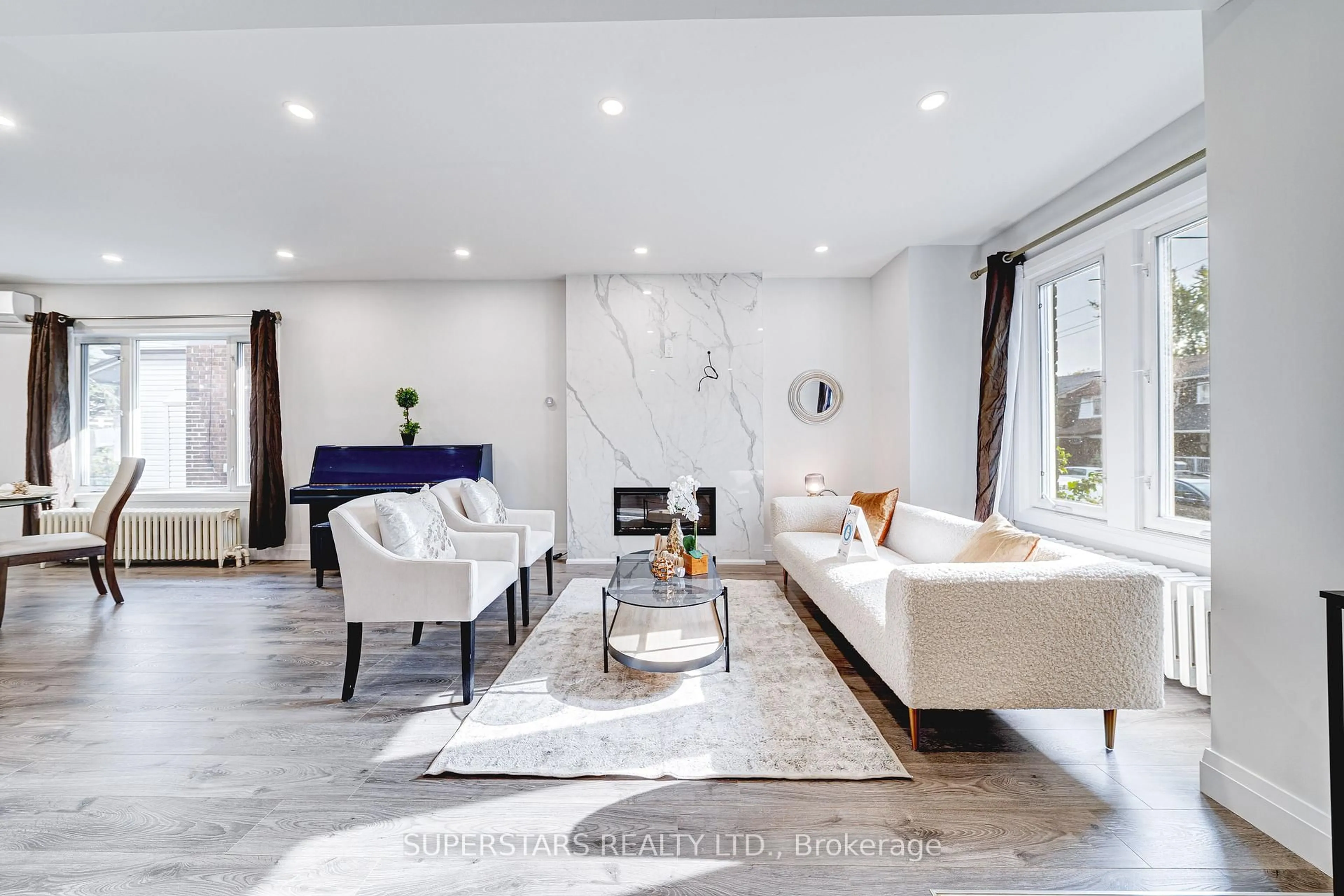 Living room with furniture, ceramic/tile floor for 179 Oakwood Ave, Toronto Ontario M6E 2V1