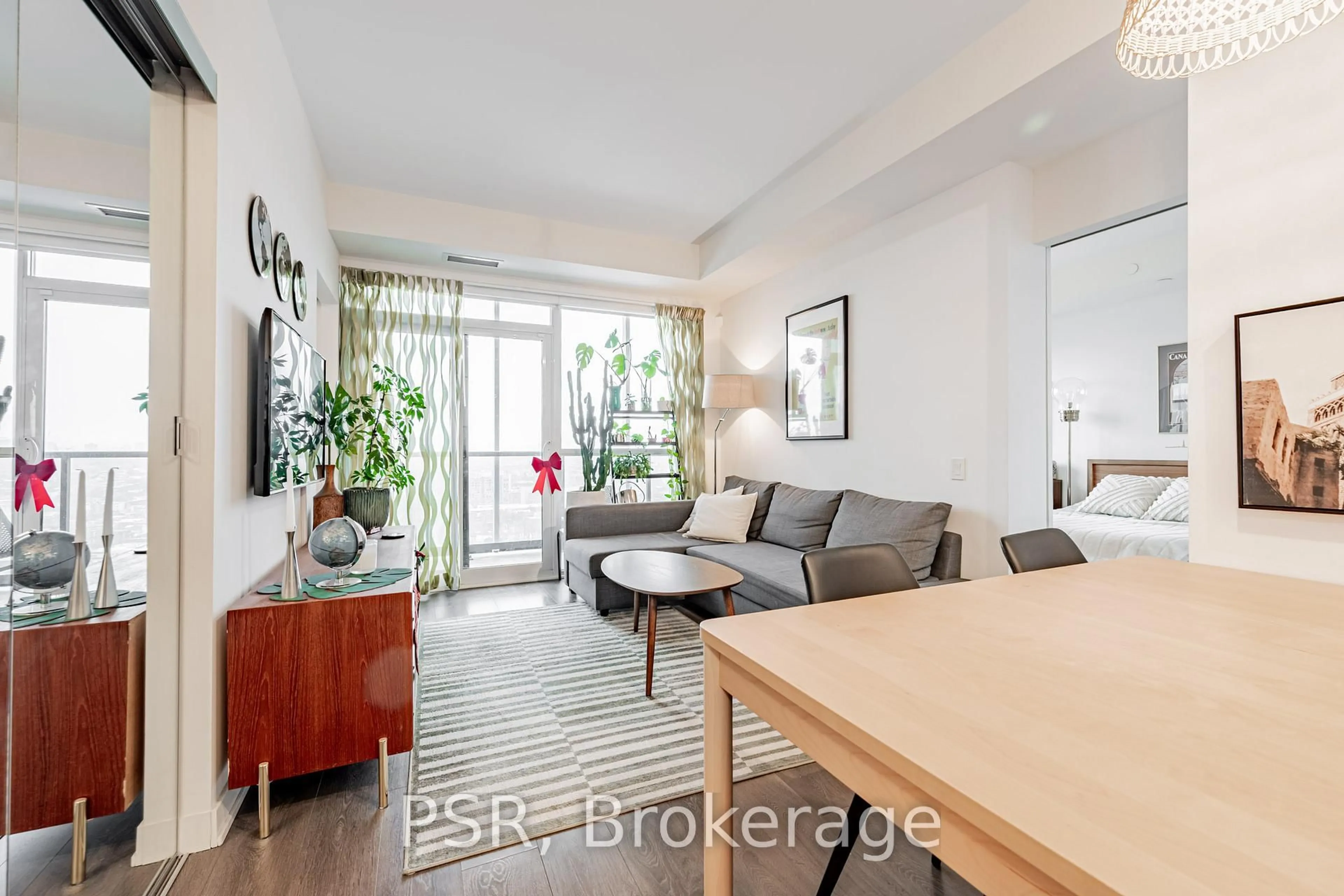 Living room with furniture, wood/laminate floor for 30 Ordnance St #2306, Toronto Ontario M6K 0C8