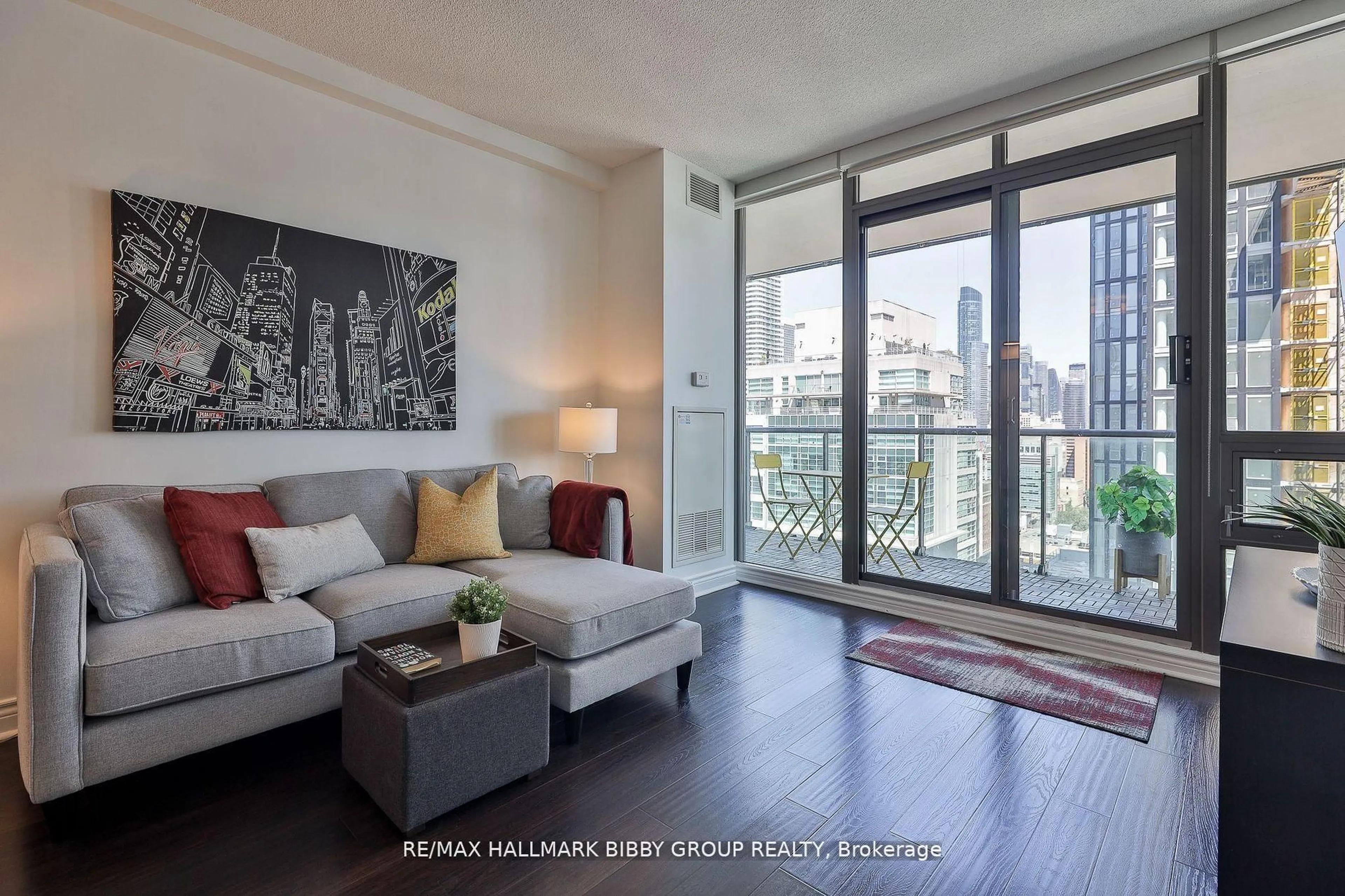Living room with furniture, wood/laminate floor for 33 Lombard St #2204, Toronto Ontario M5C 3H8