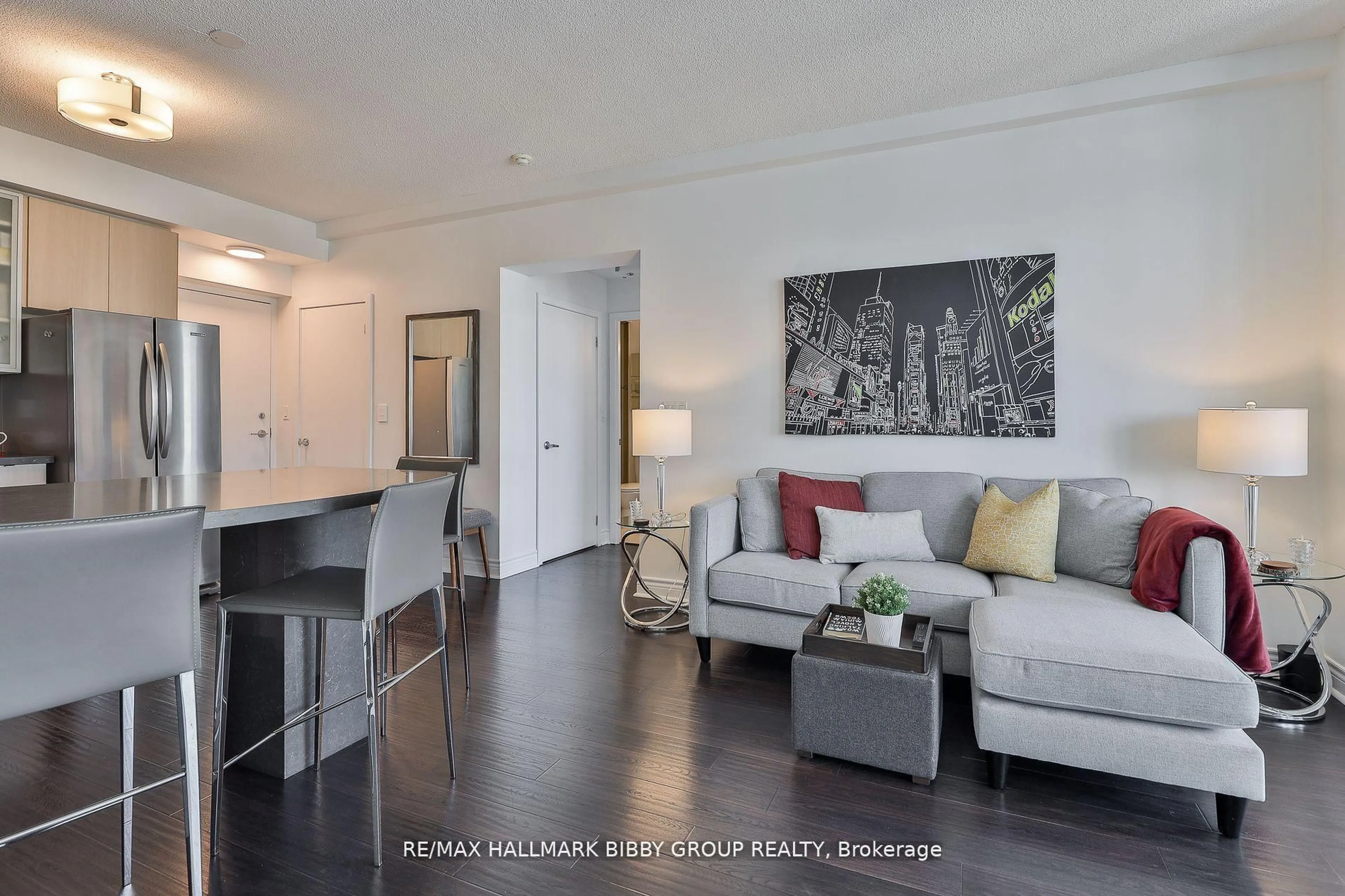 Living room with furniture, wood/laminate floor for 33 Lombard St #2204, Toronto Ontario M5C 3H8