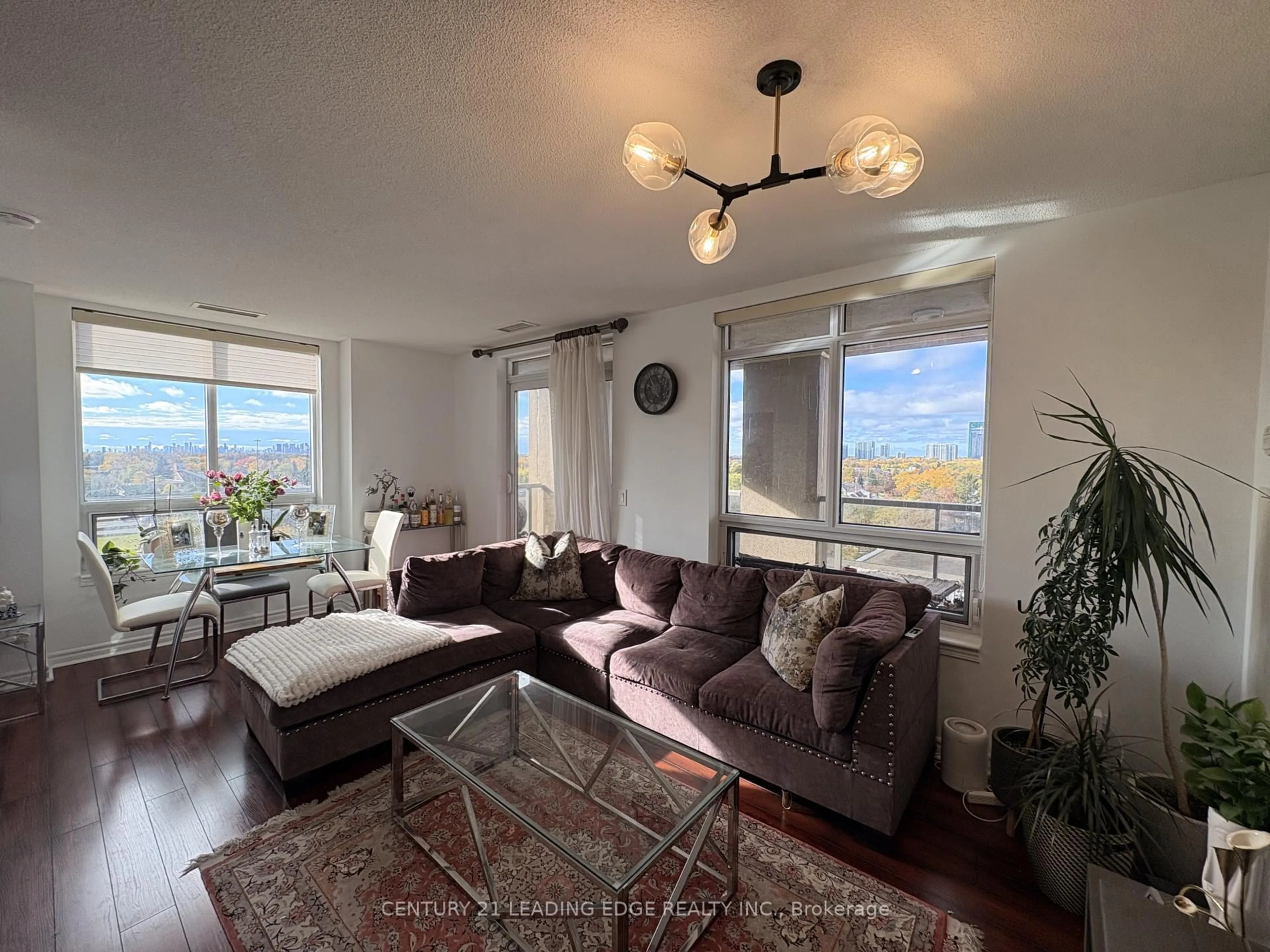 Living room with furniture, wood/laminate floor for 18 Kenaston Gdns #712, Toronto Ontario M2K 3C7