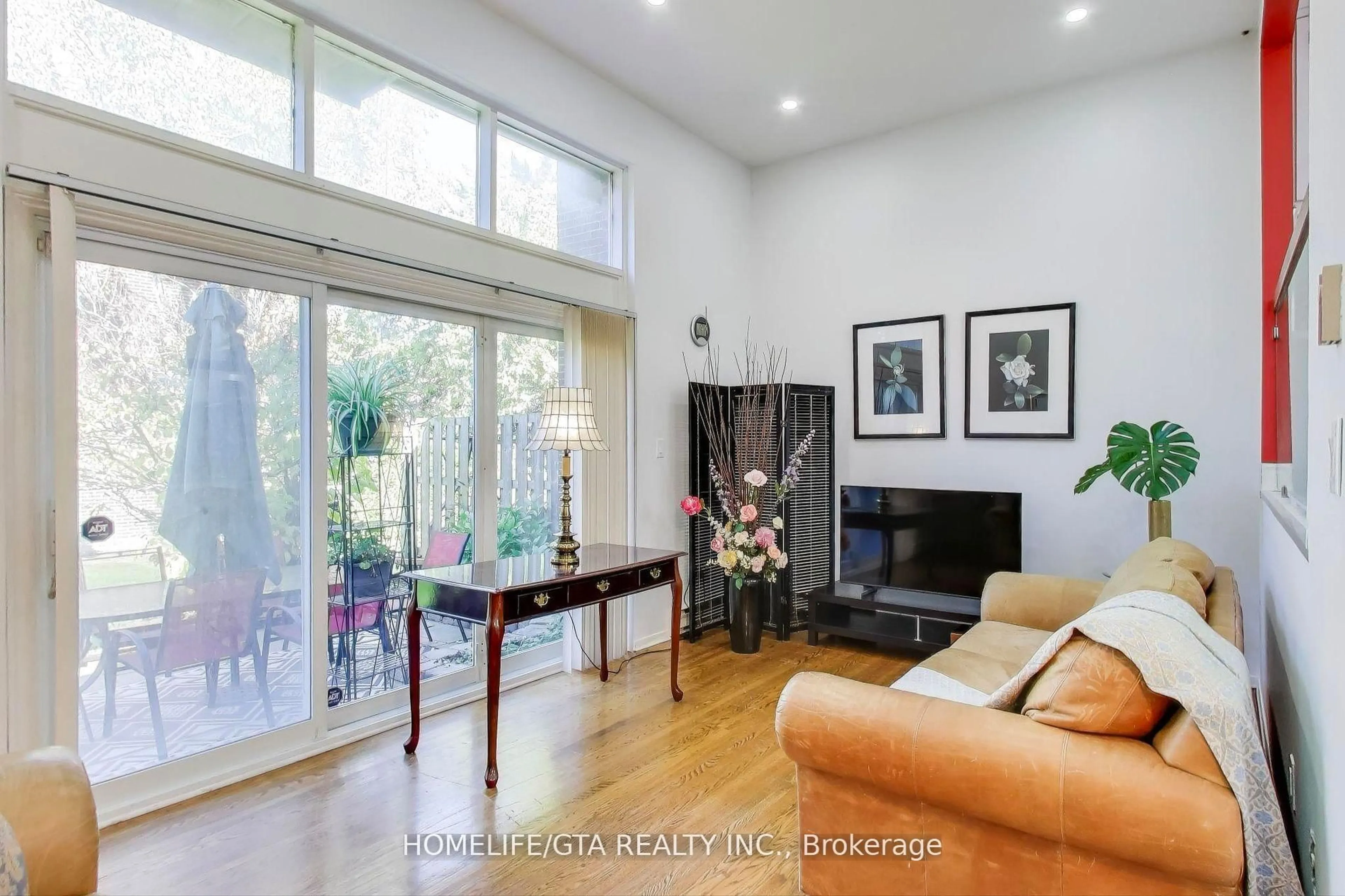 Living room with furniture, wood/laminate floor for 6 Windy Gfwy, Toronto Ontario M3C 3A7