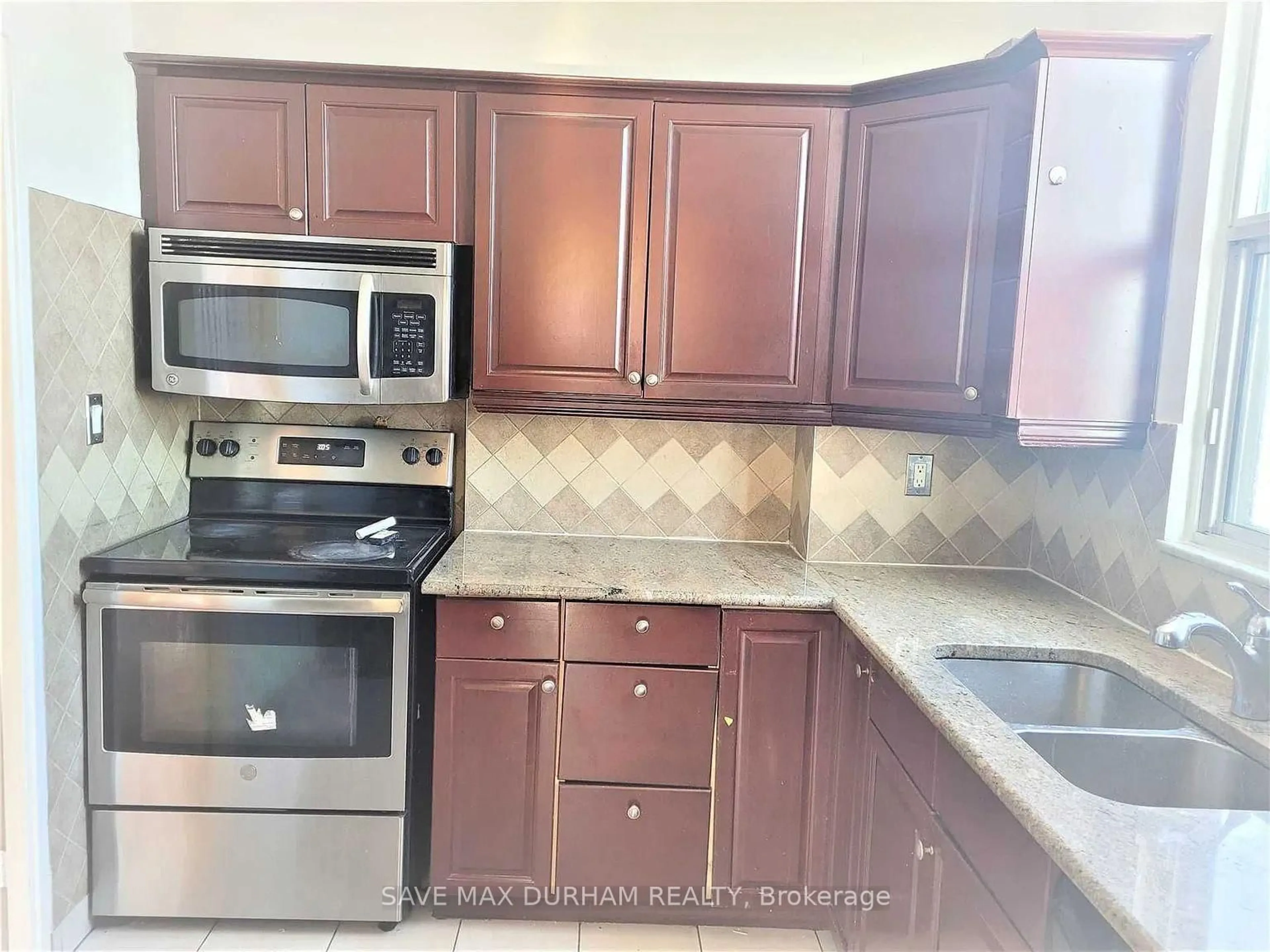 Standard kitchen, ceramic/tile floor for 60 Pavane Linkway #1208, Toronto Ontario M3C 2Y6