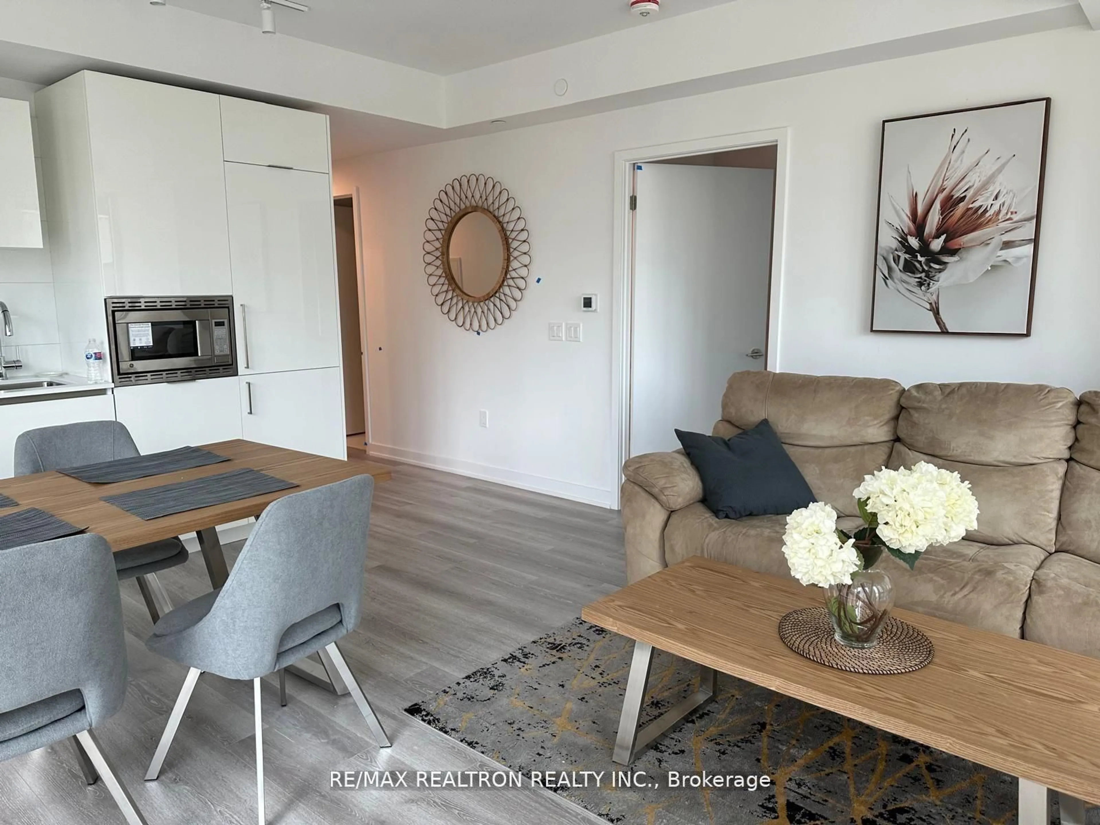 Living room with furniture, wood/laminate floor for 230 Simcoe St #926, Toronto Ontario M5T 1T4