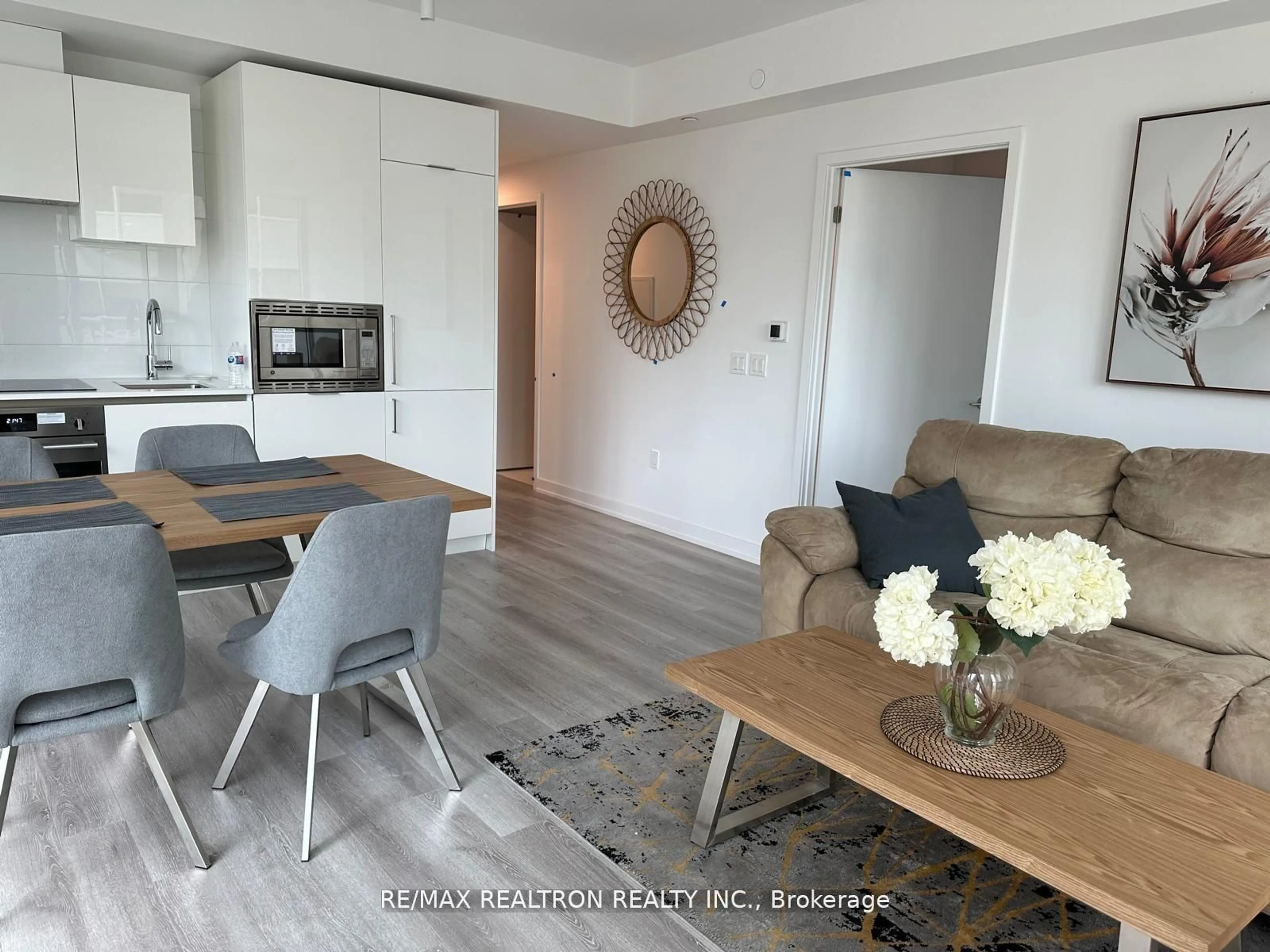 Living room with furniture, wood/laminate floor for 230 Simcoe St #926, Toronto Ontario M5T 1T4