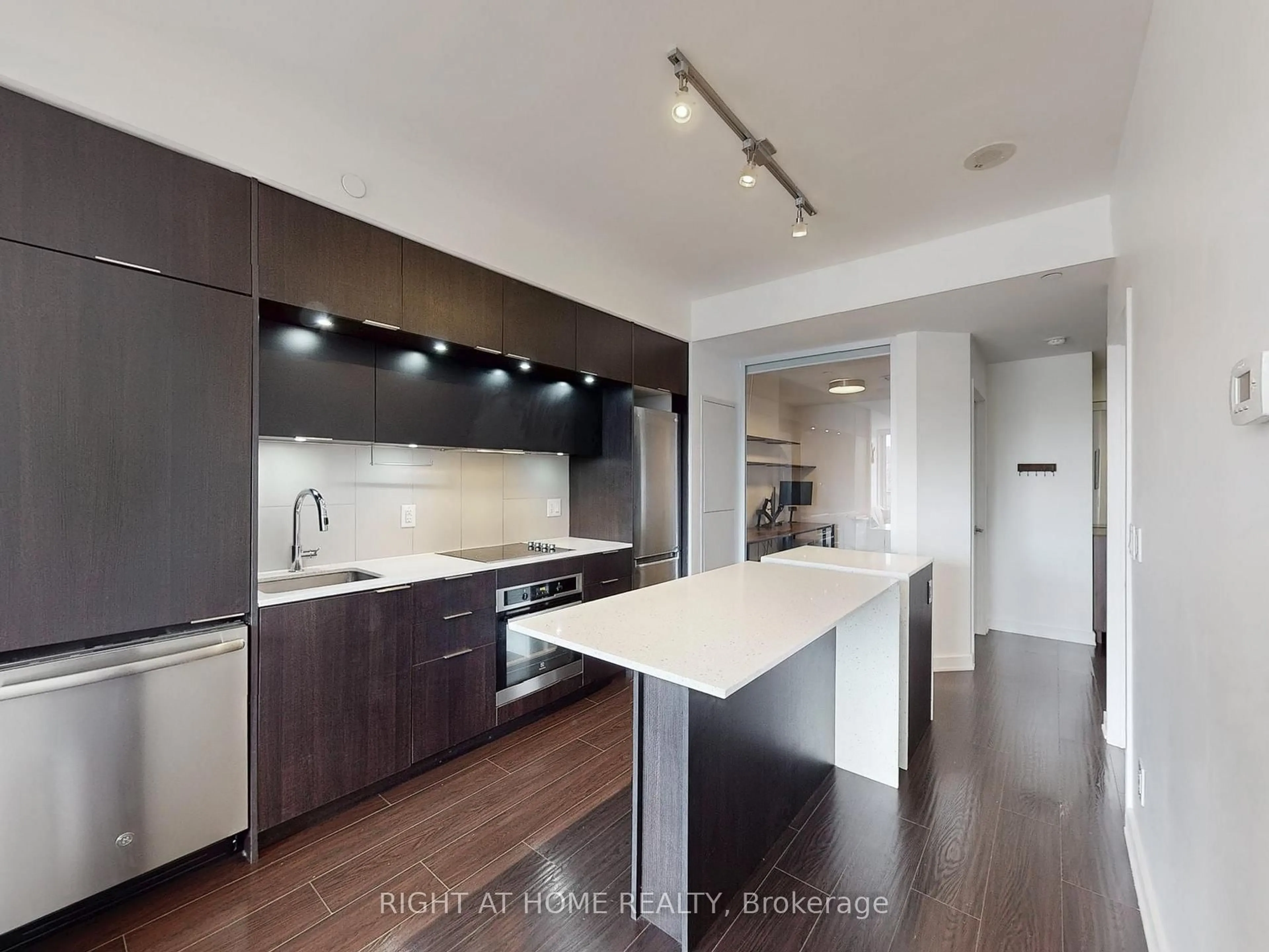 Contemporary kitchen, wood/laminate floor for 55 Regent Park Blvd #1407, Toronto Ontario M5A 0C2